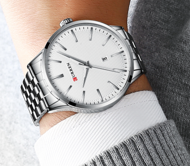 PAMOLA Metal Watch I 550901 featuring a round dial, stainless steel wristband, and Curren logo, showcasing elegance and style.