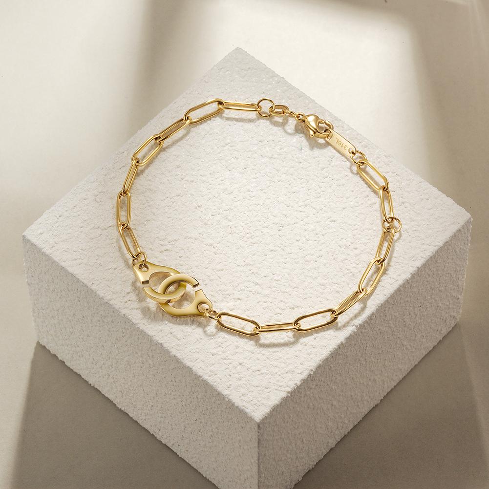 A stylish Paper Clip Link Bracelet made of 316L surgical stainless steel with a 14K gold PVD plated finish, showcasing its elegant design.