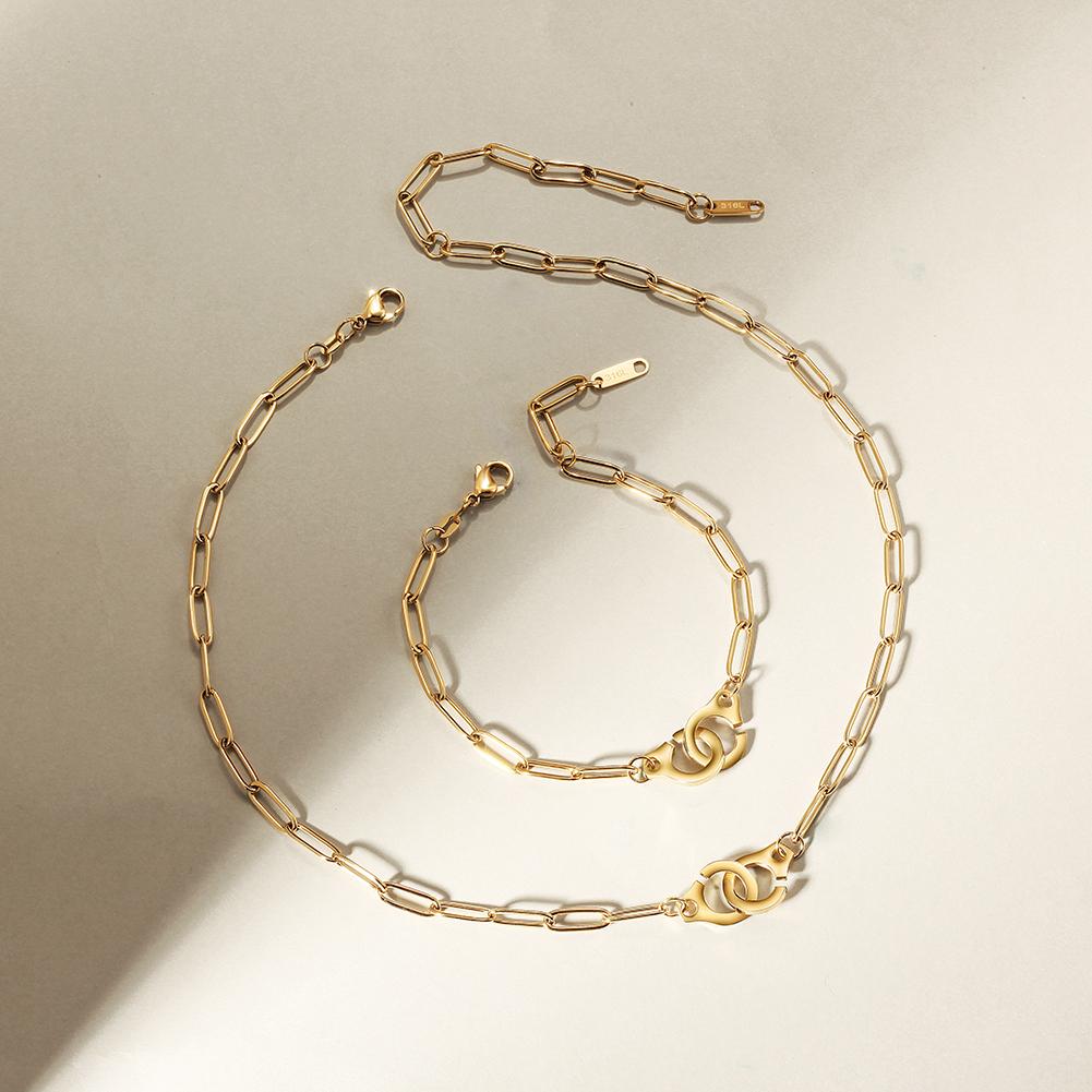 A stylish Paper Clip Link Bracelet made of 316L surgical stainless steel with a 14K gold PVD plated finish, showcasing its elegant design.