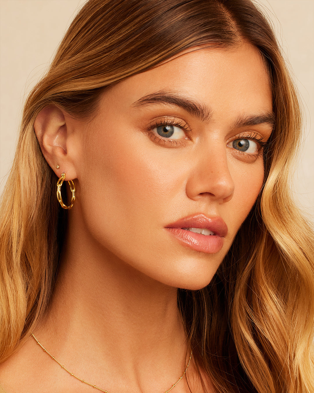 Elegant Parker Link Hoops featuring a unique link design, crafted from high-quality materials for a timeless look.