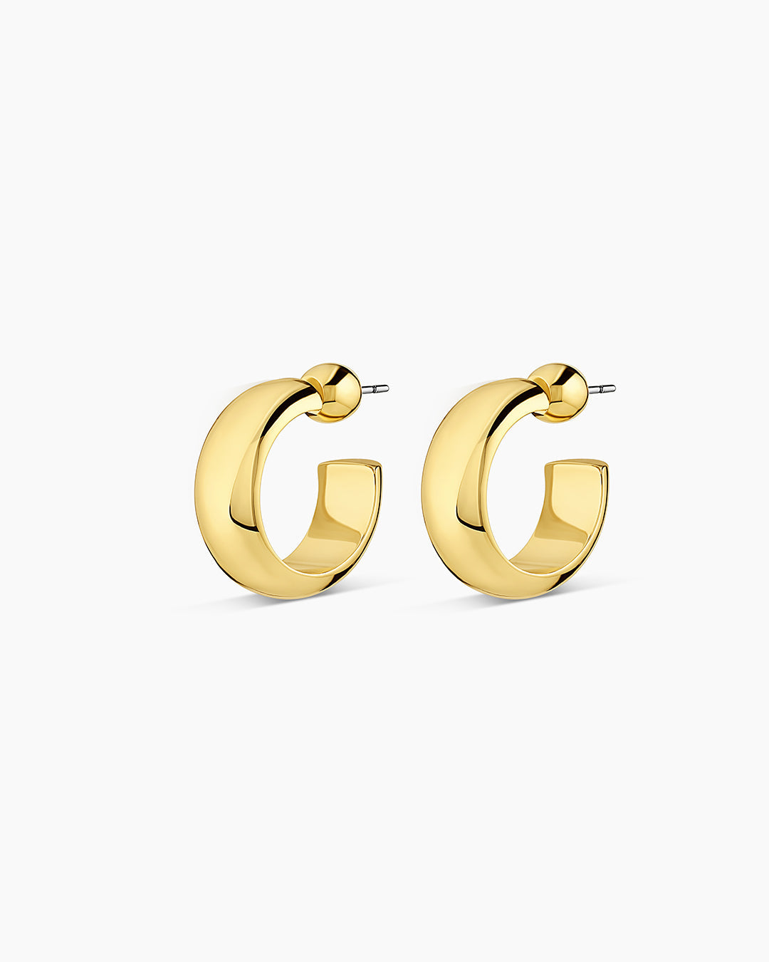 A pair of elegant 14k gold small hoop earrings, showcasing a minimalist design perfect for layering.