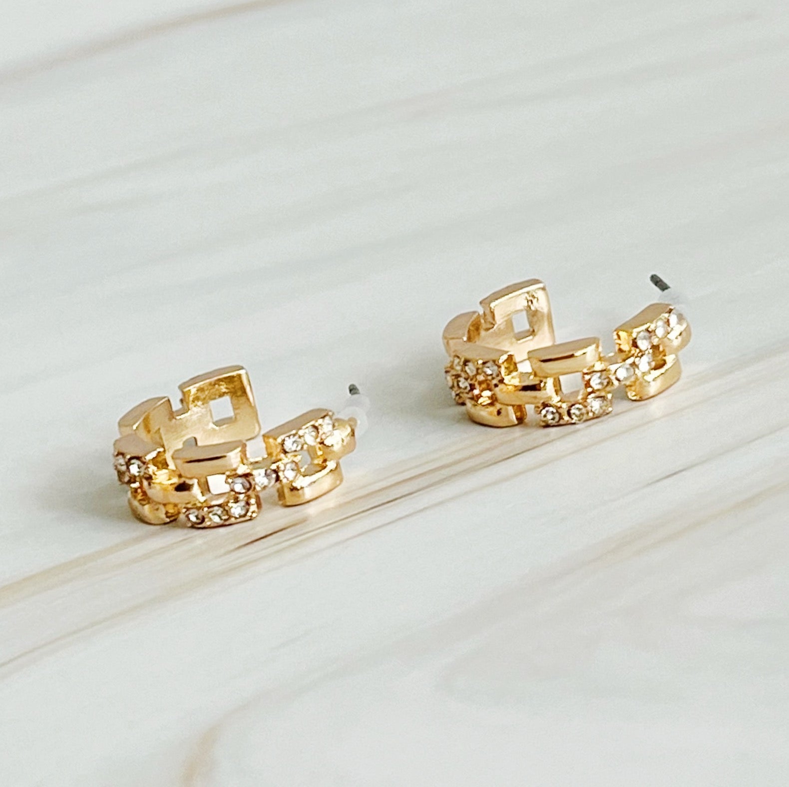 Elegant Pave Huggie Hoop Earrings with sparkling pave detailing, designed for comfort and style.