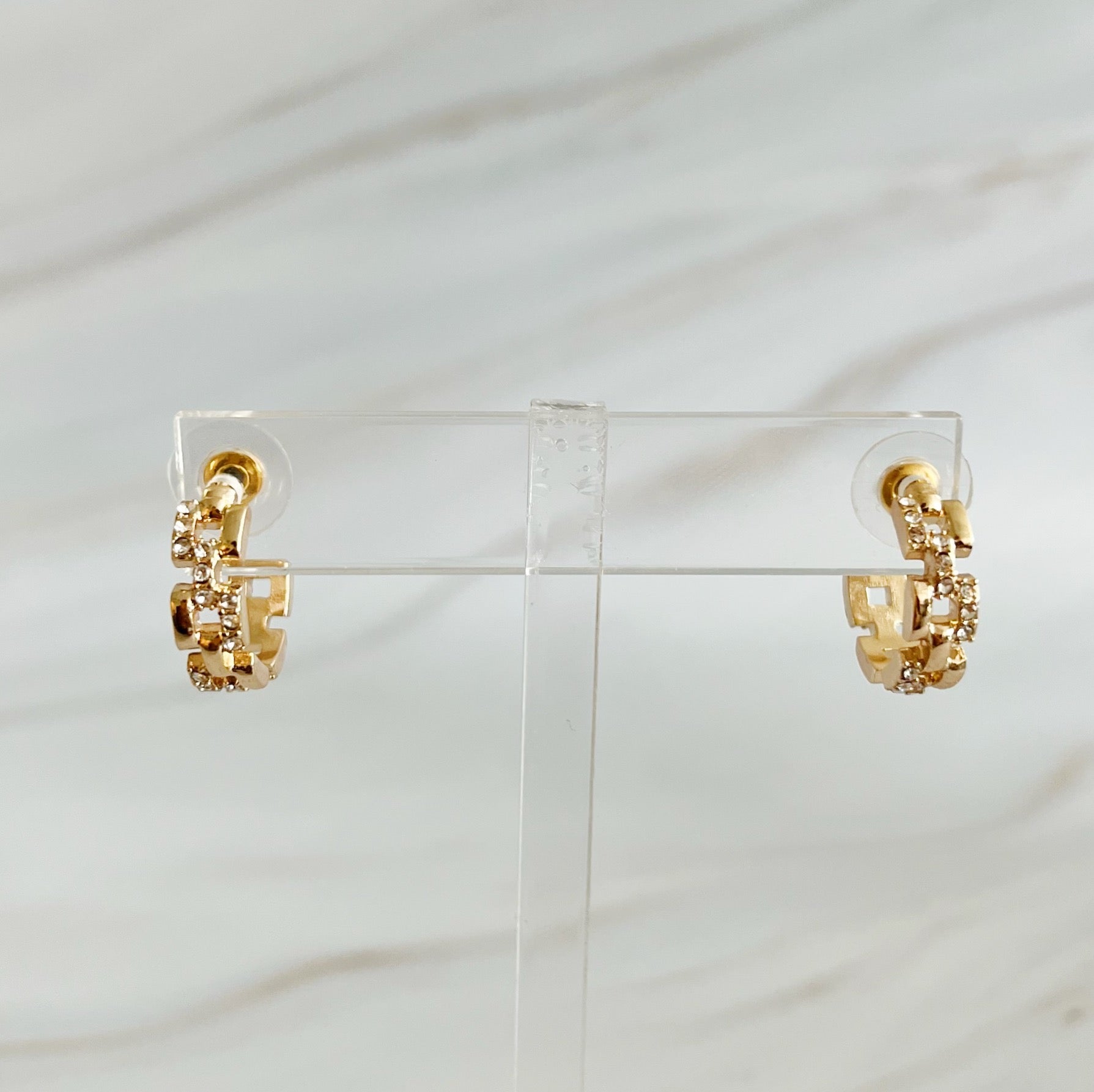 Elegant Pave Huggie Hoop Earrings with sparkling pave detailing, designed for comfort and style.