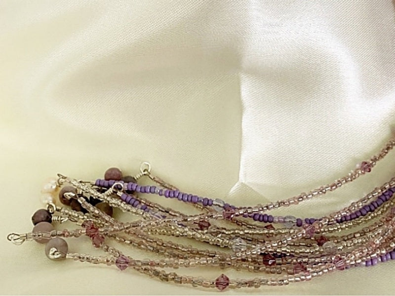 A beautiful Pearl and Lilac Jade Lariat Necklace featuring freshwater pearls, lilac jade, and a faux rhinestone heart button, elegantly displayed.