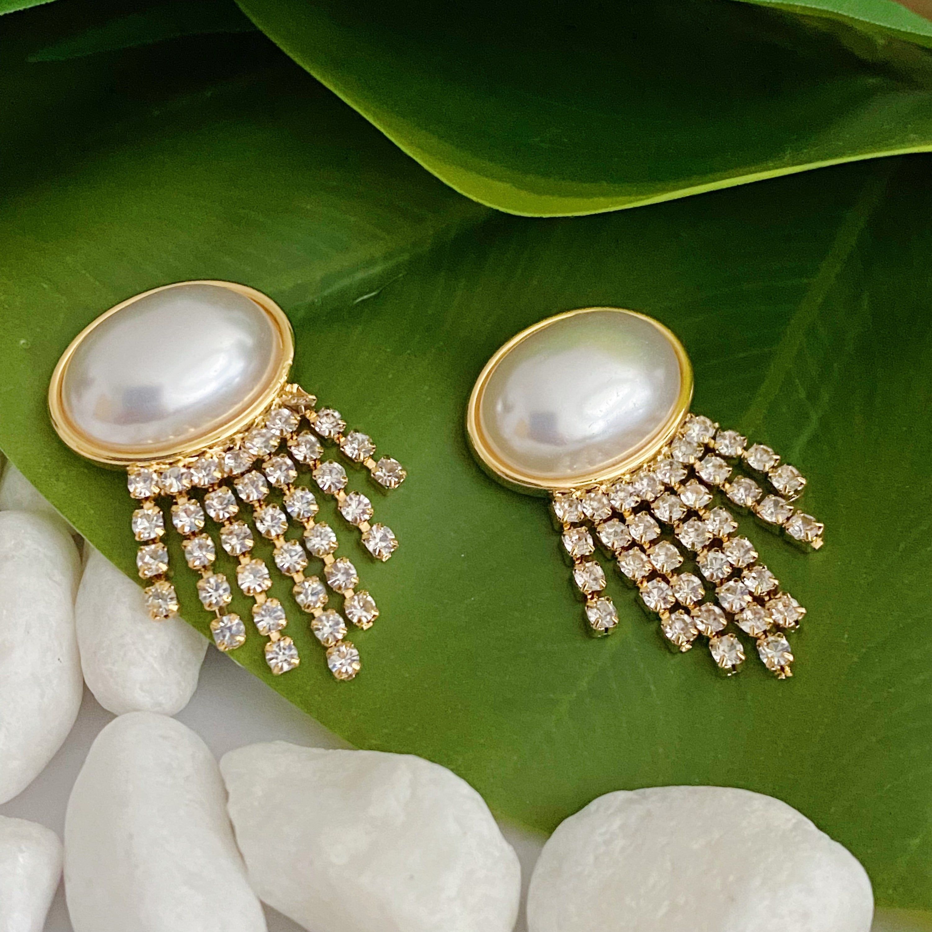 Elegant Pearl Button Cascade Shine Earrings featuring button-shaped pearls and shiny strands, perfect for a vintage look.
