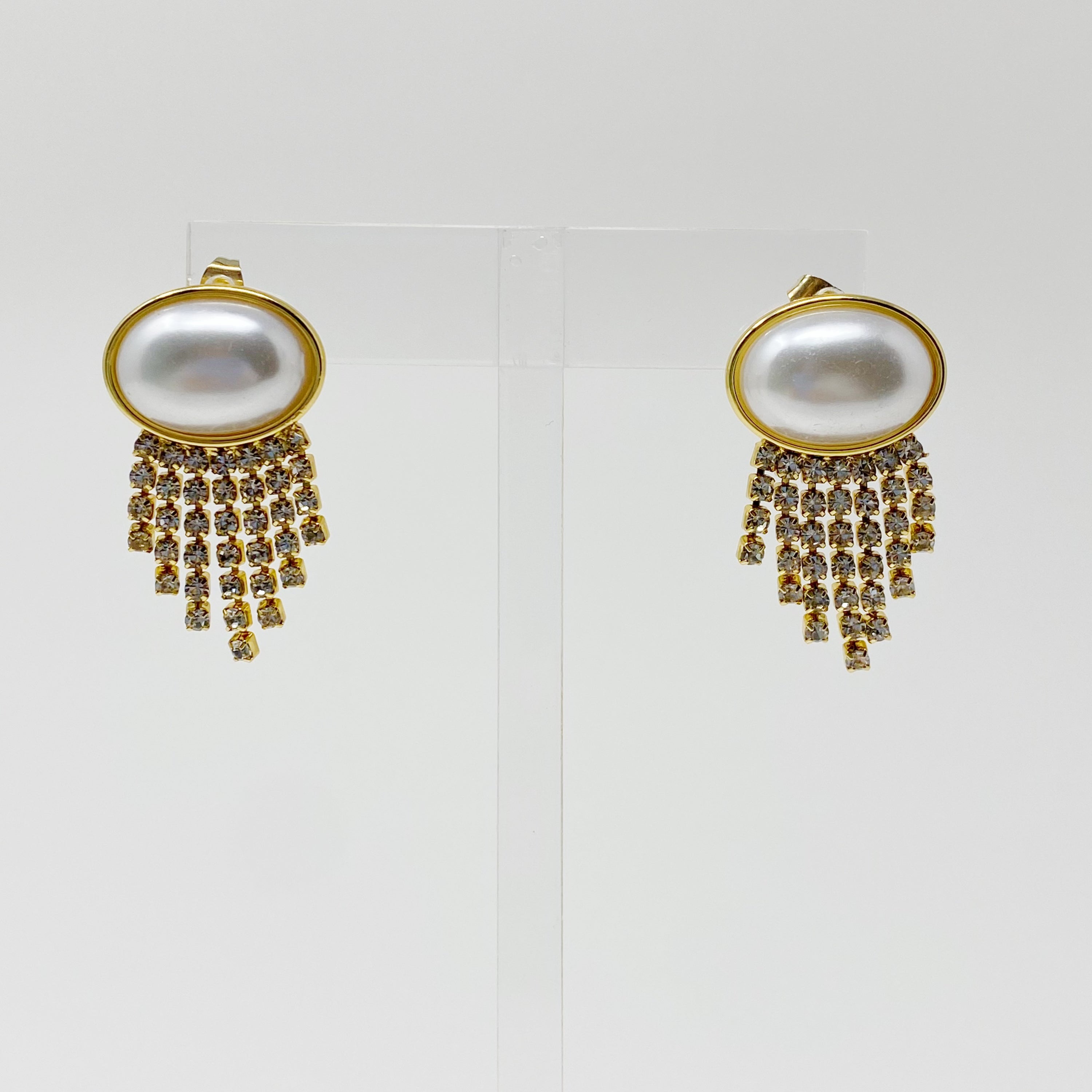 Elegant Pearl Button Cascade Shine Earrings featuring button-shaped pearls and shiny strands, perfect for a vintage look.