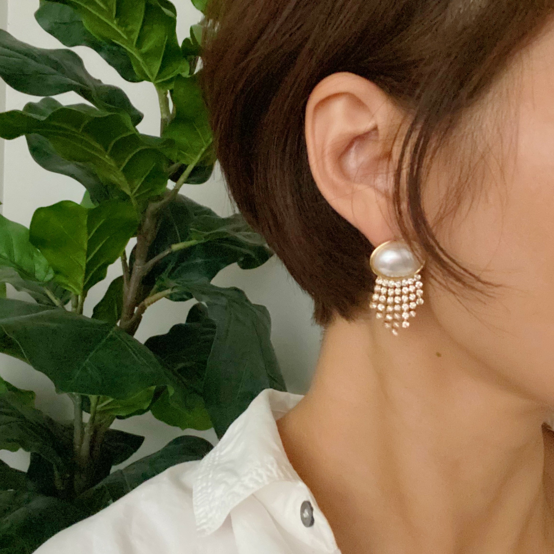 Elegant Pearl Button Cascade Shine Earrings featuring button-shaped pearls and shiny strands, perfect for a vintage look.