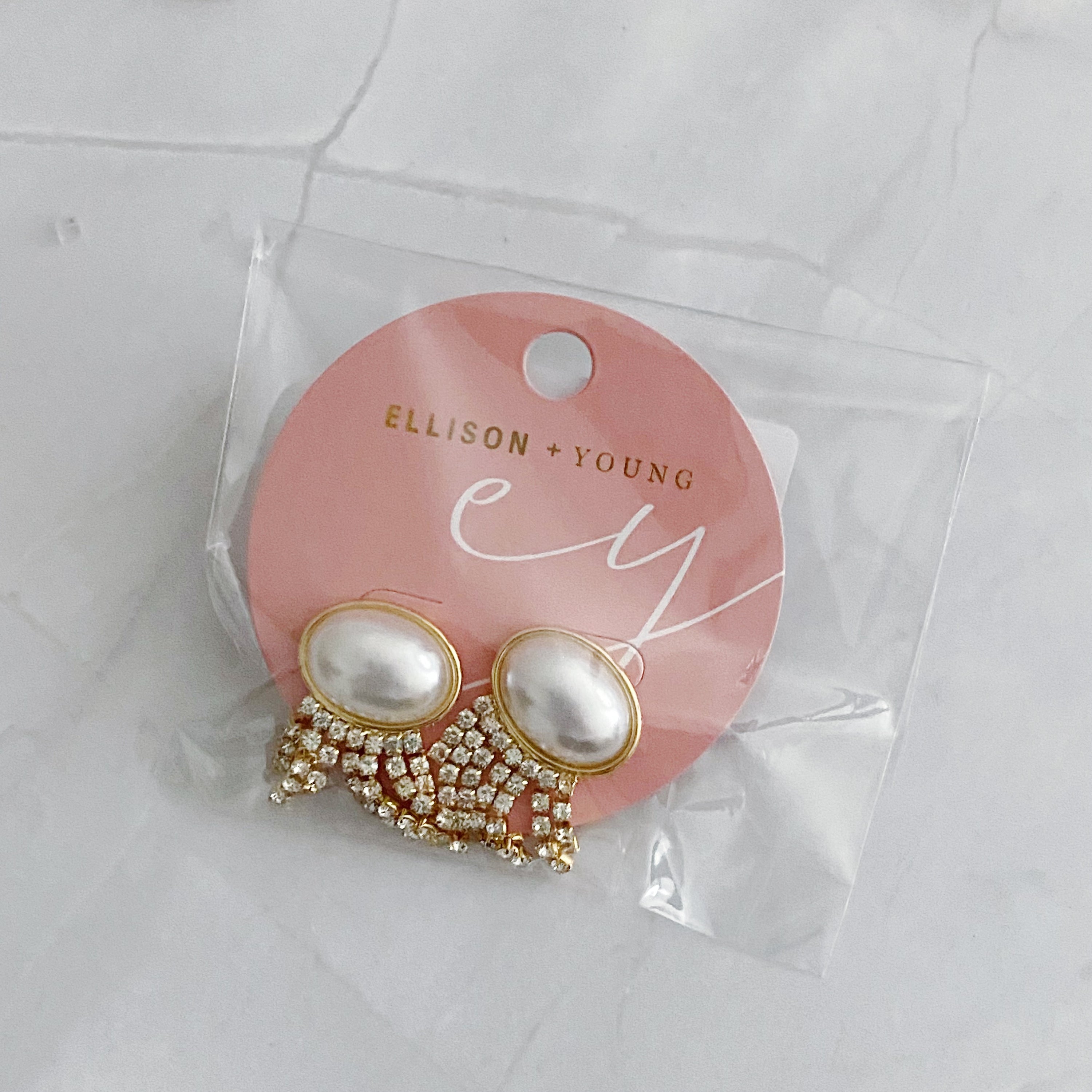 Elegant Pearl Button Cascade Shine Earrings featuring button-shaped pearls and shiny strands, perfect for a vintage look.