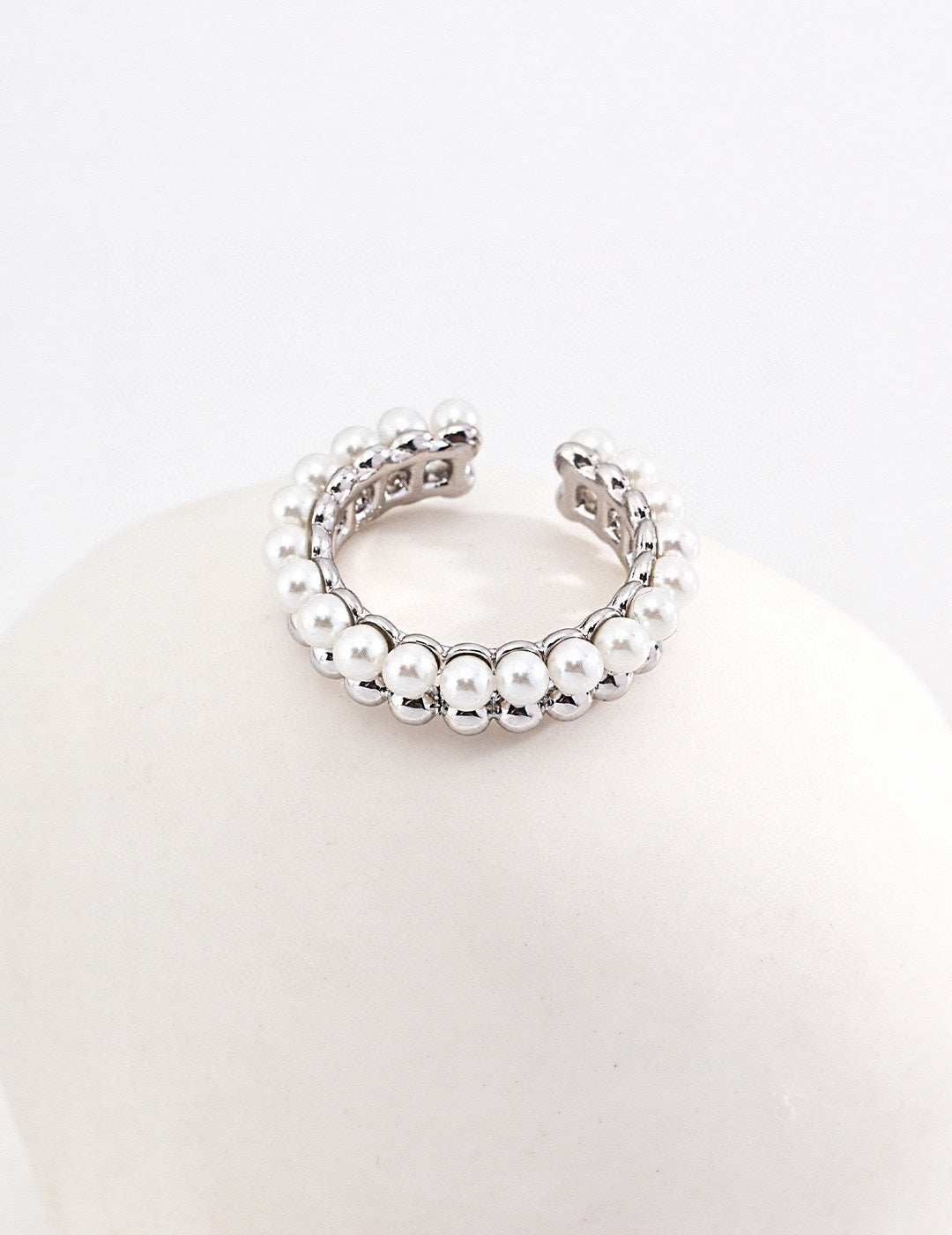 A stunning adjustable silver ring featuring a fusion of lustrous pearls and shimmering silver mini balls, perfect for any occasion.