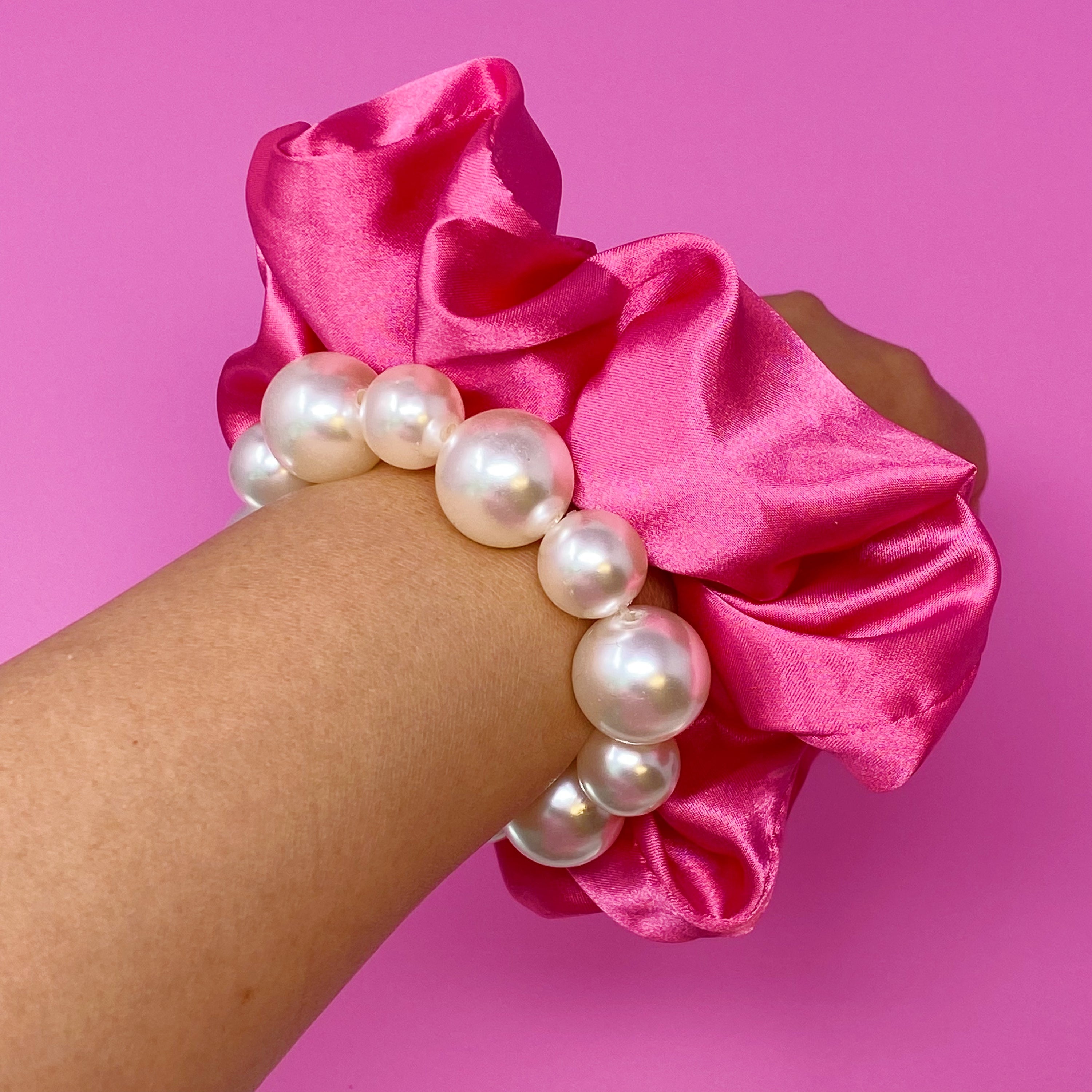 A stylish Pearl & Satin Scrunchie Set featuring elegant satin fabric and pearl accents, perfect for any hairstyle.