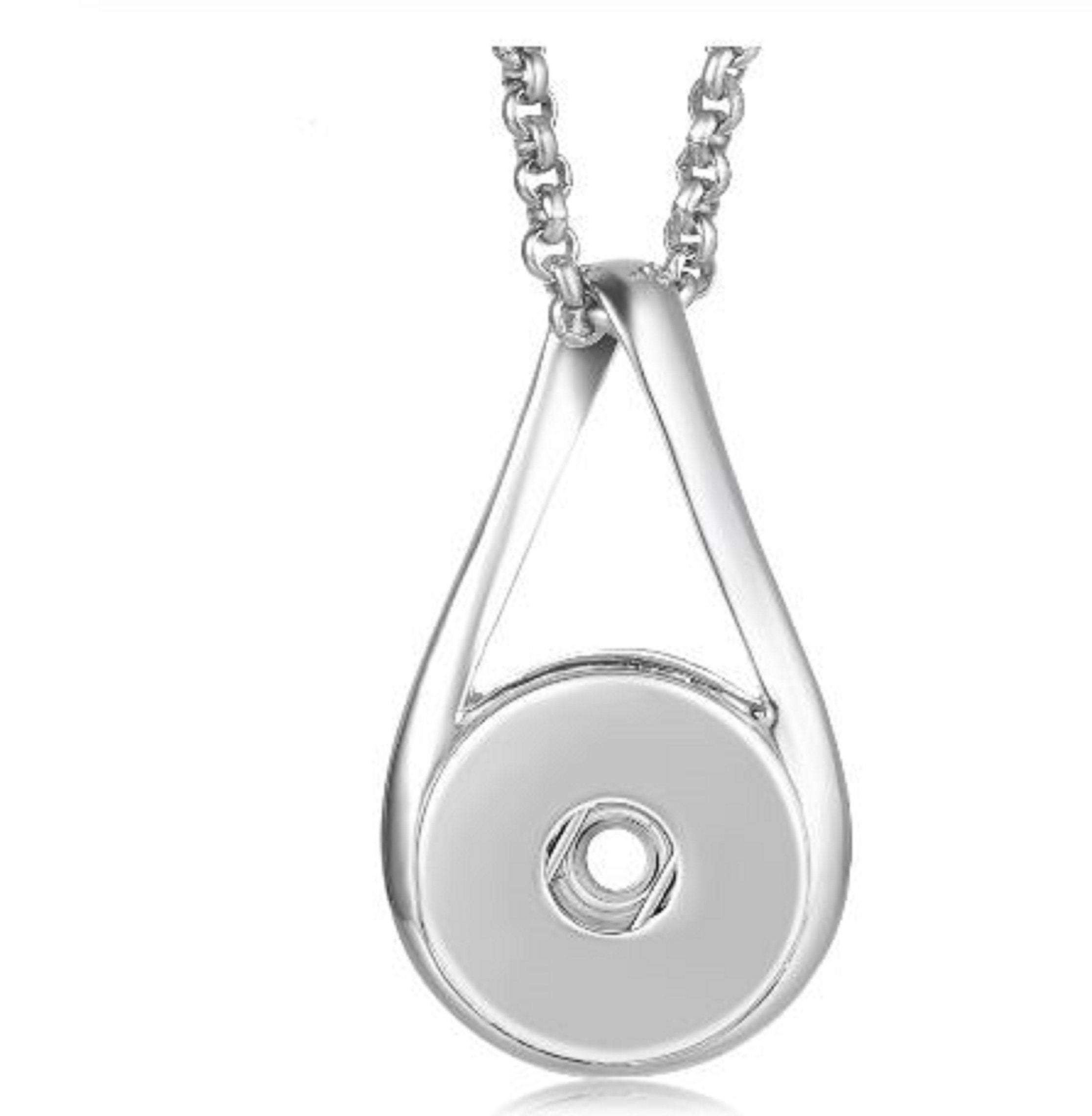 Simple Teardrop Style Snap Jewelry Pendant with matching chain and extender, showcasing its elegant design.