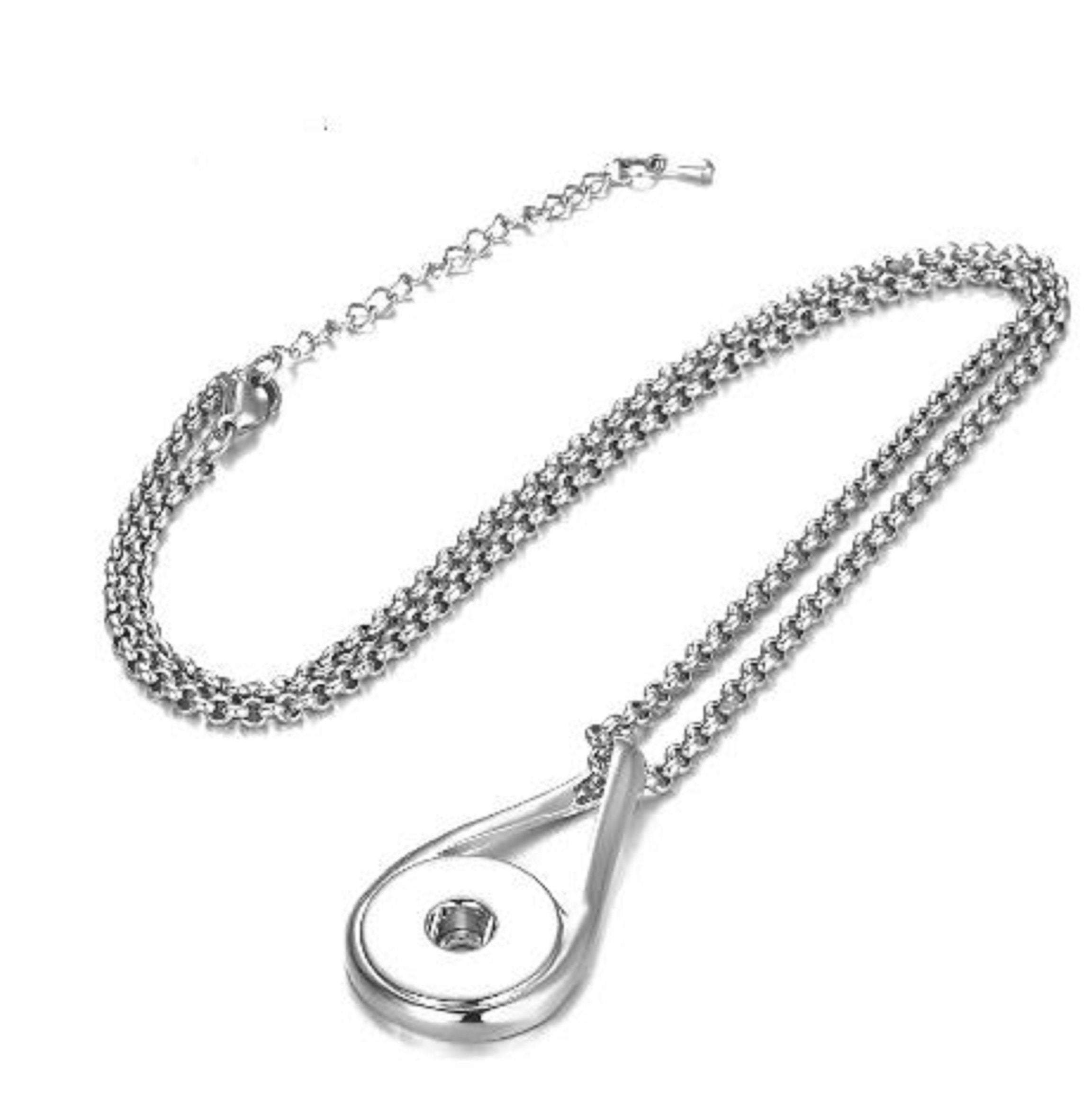 Simple Teardrop Style Snap Jewelry Pendant with matching chain and extender, showcasing its elegant design.