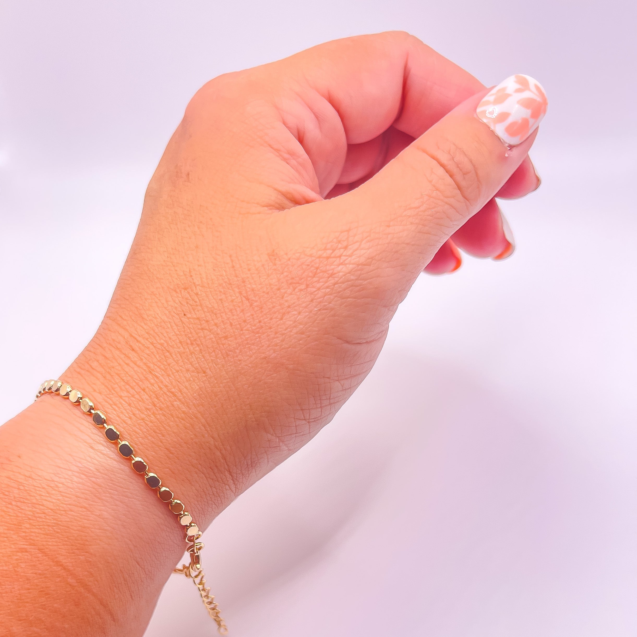 Penelope 18K Gold Filled Bracelet/Anklet featuring a dainty flat ball disc design, shining elegantly in light.