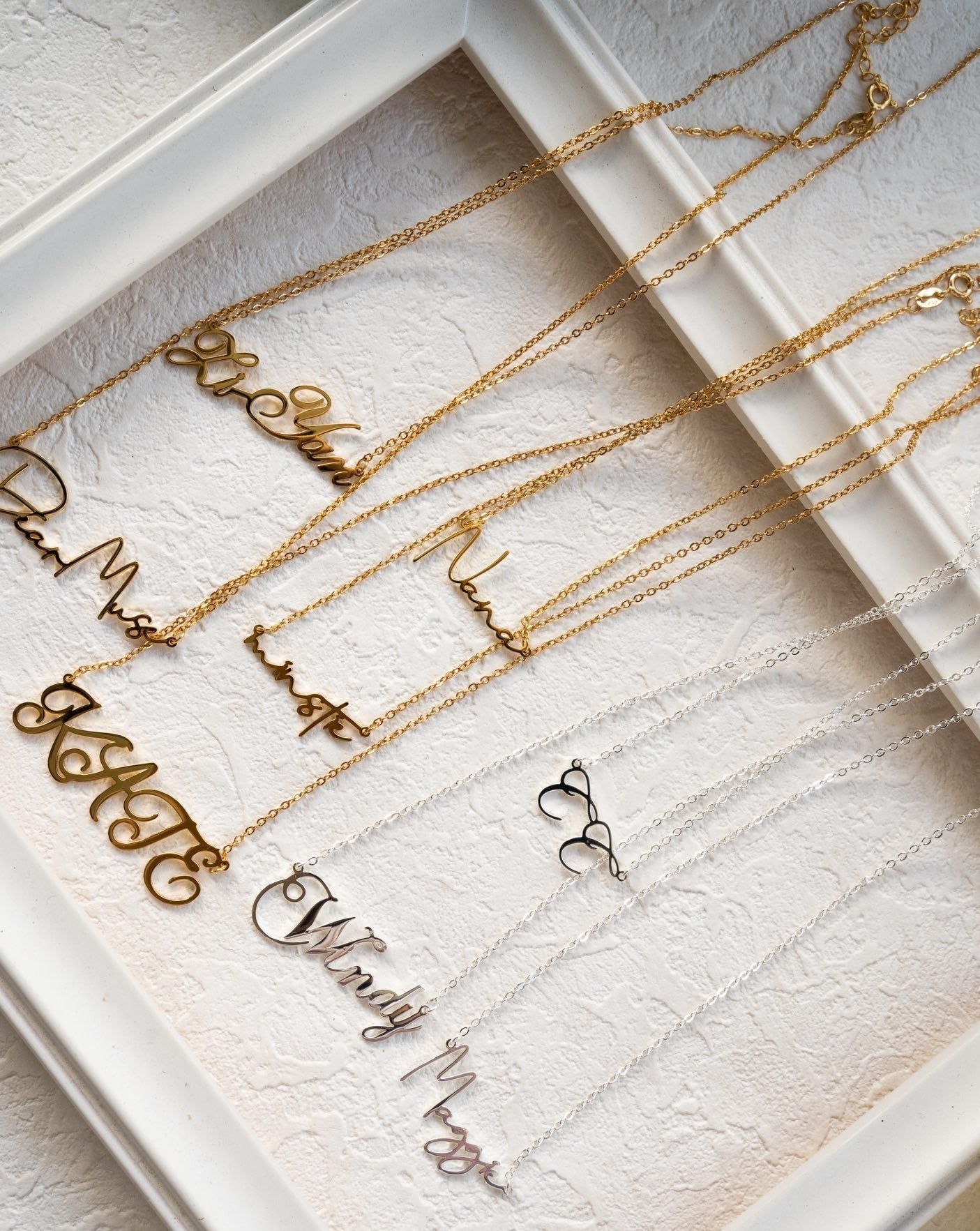 A stunning silver necklace featuring customizable letters, crafted from high-quality 925 Sterling Silver, showcasing elegance and personalization.