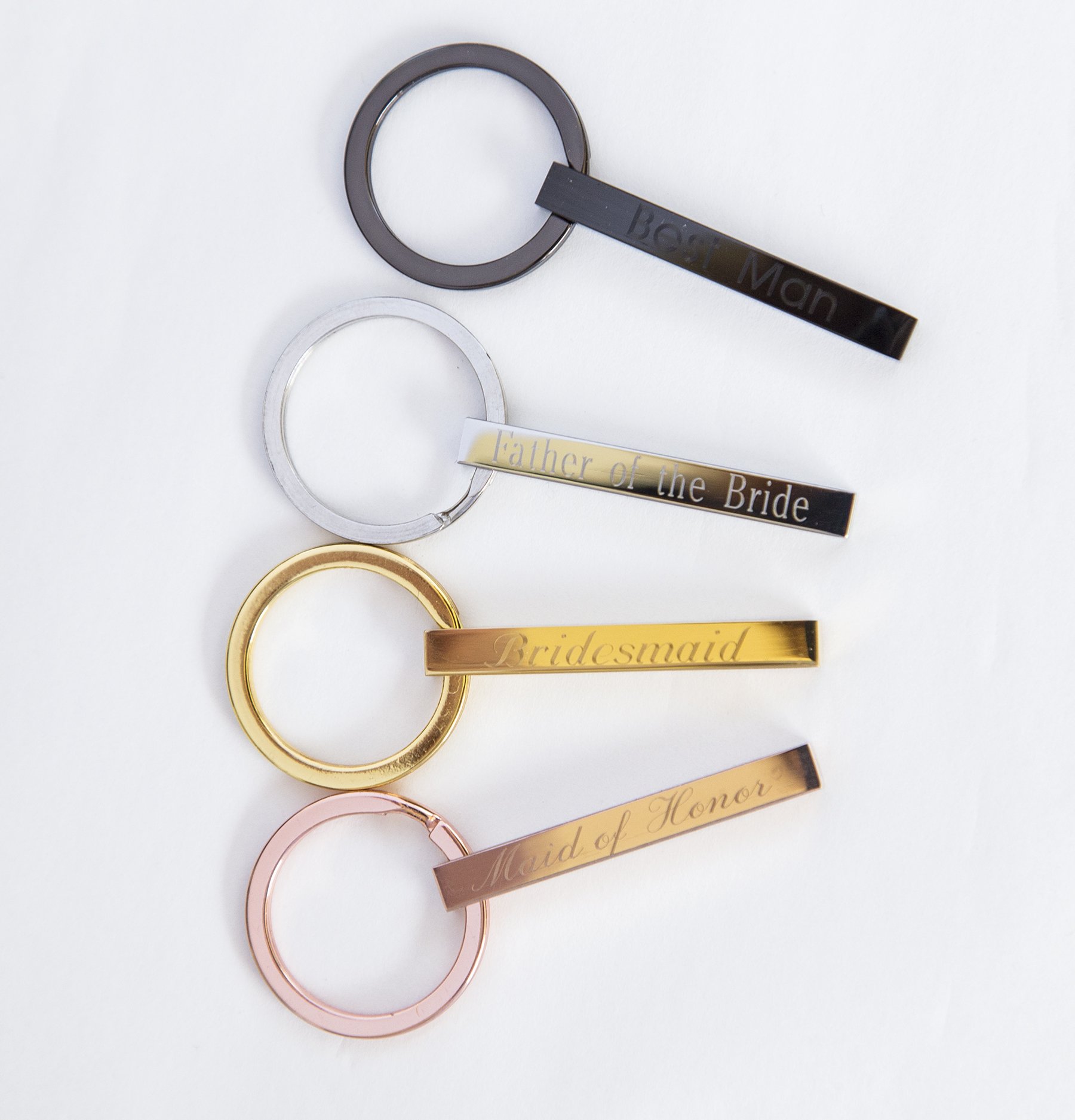 Personalized engraved stainless steel keychain with custom text on all sides, showcasing its compact design and high-quality finish.