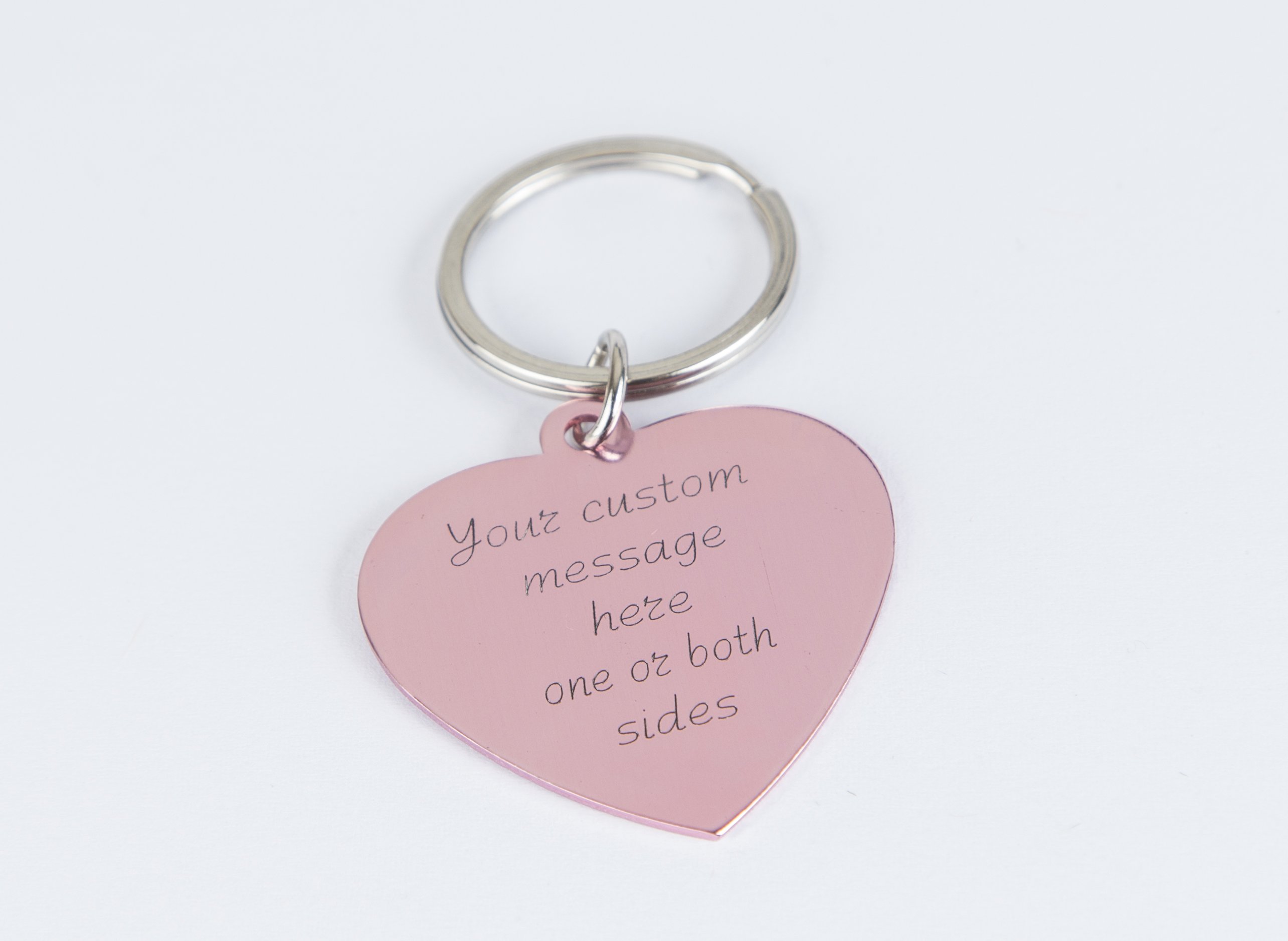 Personalized engraved pink heart keychain with a stainless steel keyring and lightweight aluminum tag, showcasing custom engraving options.