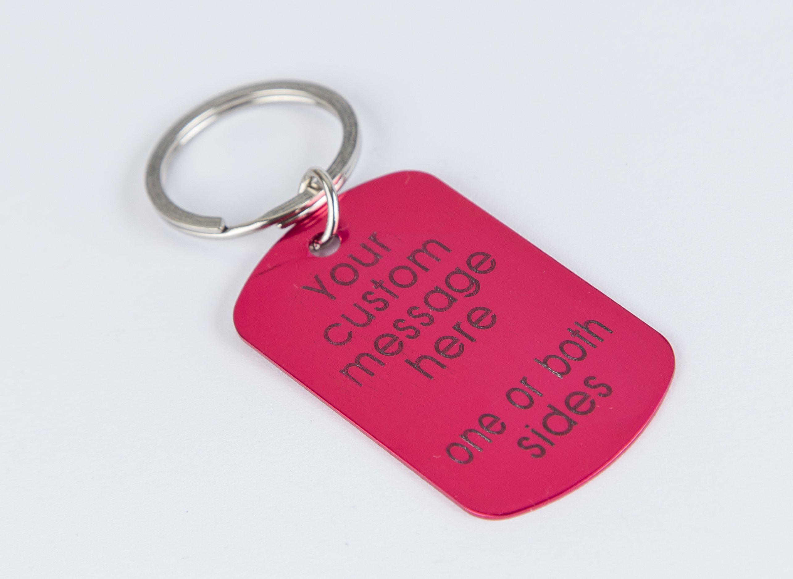 Personalized engraved pink keychain with a lightweight aluminum tag and stainless steel keyring, showcasing custom text.