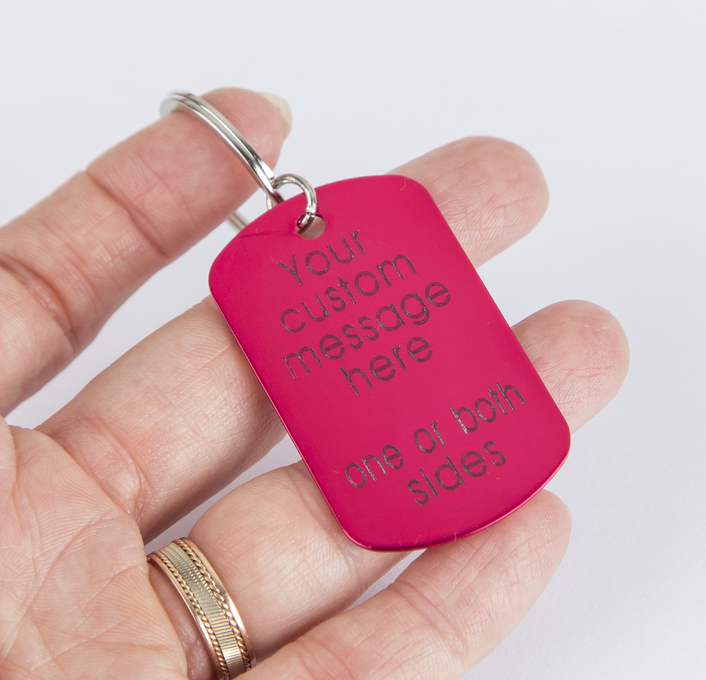 Personalized engraved pink keychain with a lightweight aluminum tag and stainless steel keyring, showcasing custom text.