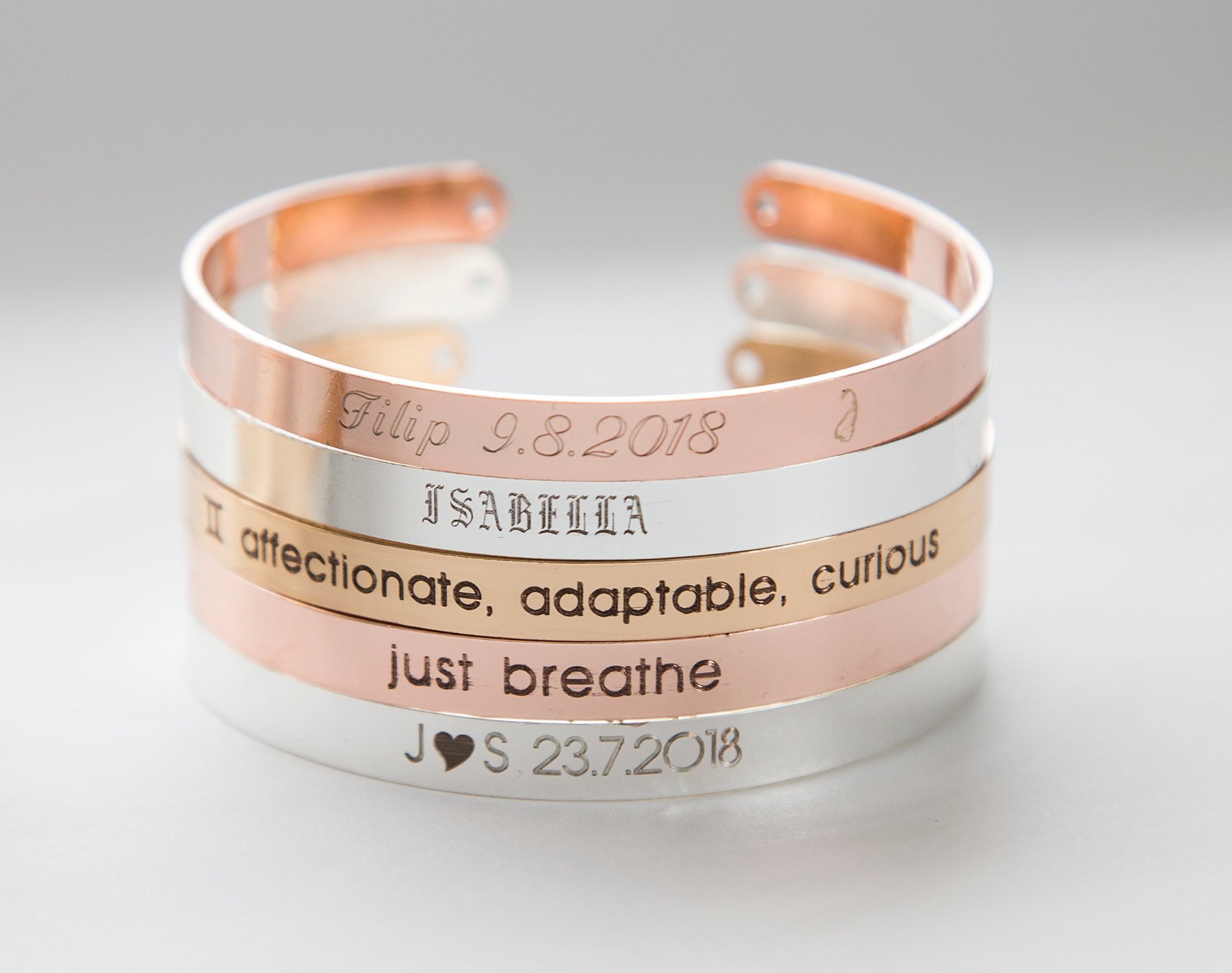 A delicate personalized name bracelet in gold plating, featuring custom engraving options and an adjustable cuff design.