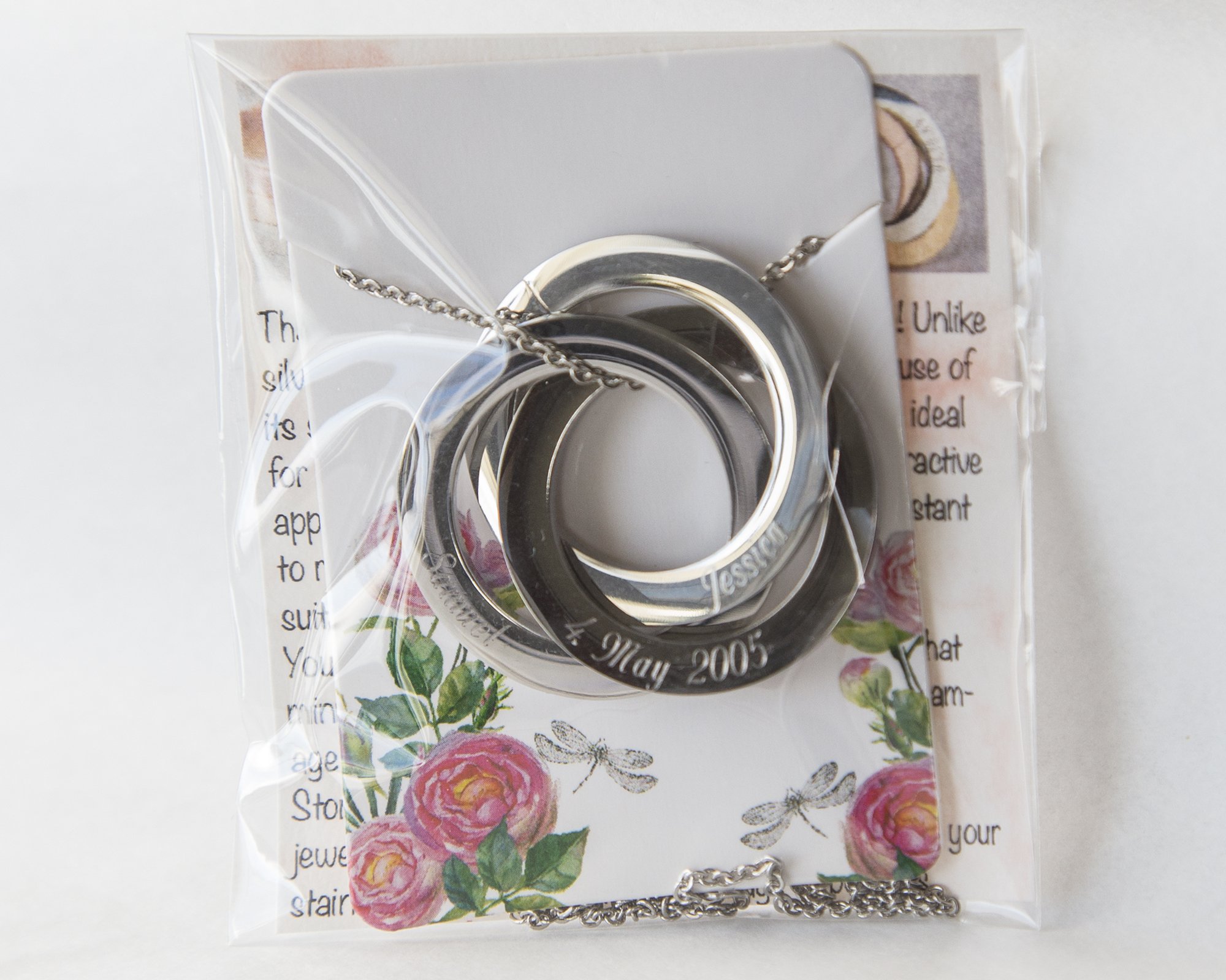 Personalized Rings Name Necklace featuring interlocked stainless steel rings with custom engravings.