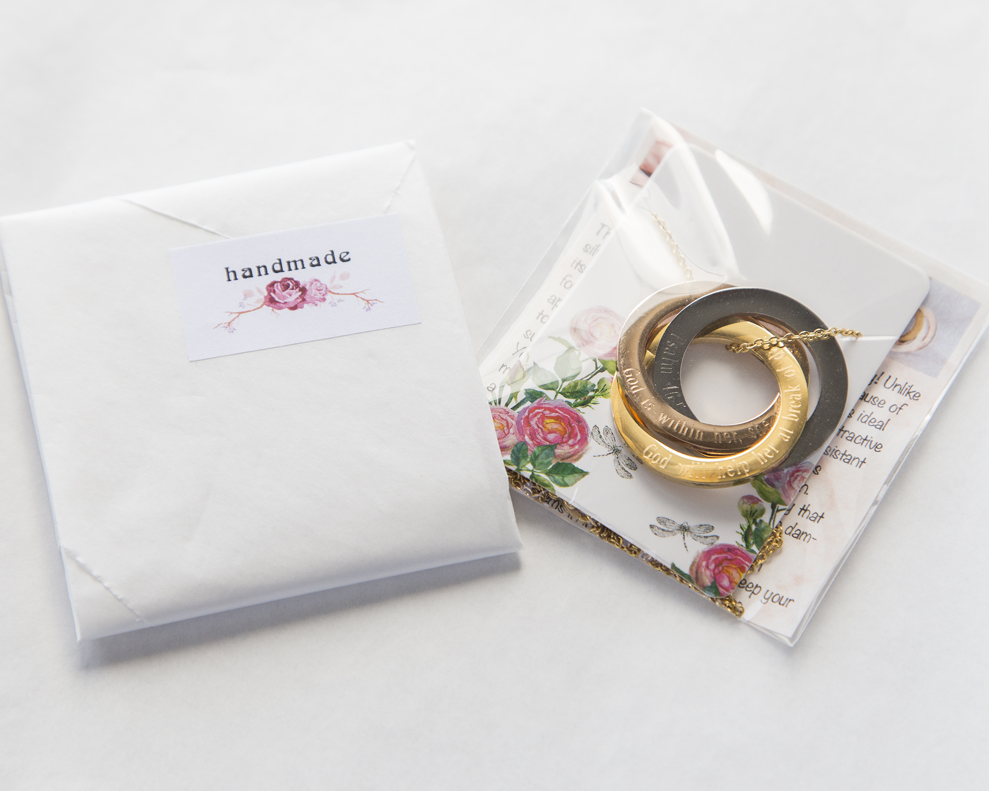 Personalized Russian Rings Eternity Necklace featuring interlocked rings with custom engravings, available in stainless steel and gold plating.