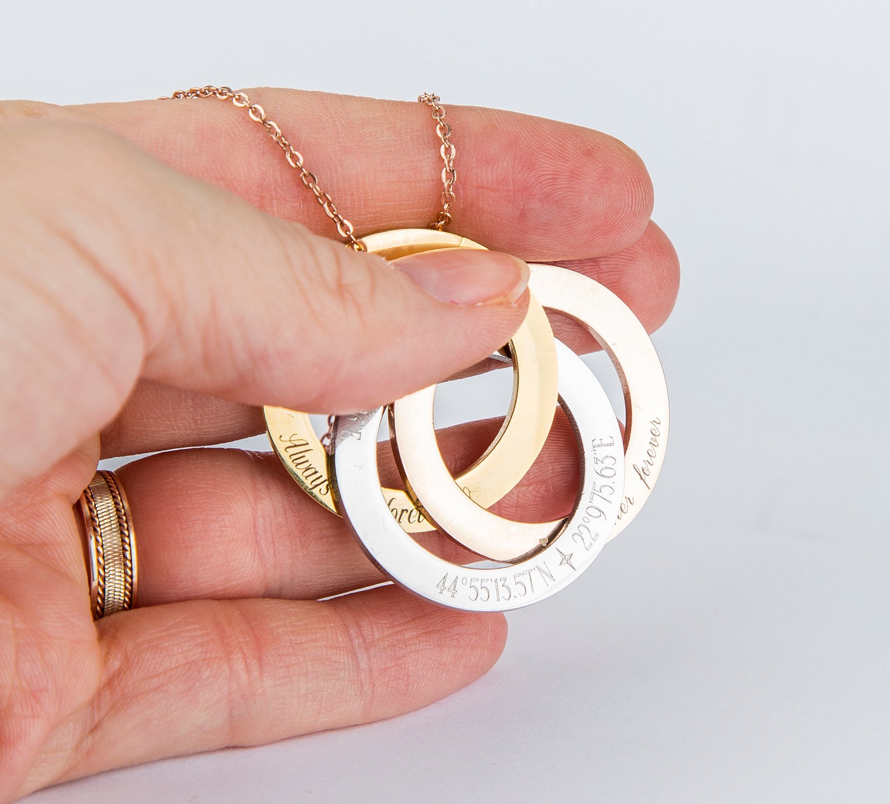 Personalized Russian Rings Eternity Necklace featuring interlocked rings with custom engravings, available in stainless steel and gold plating.