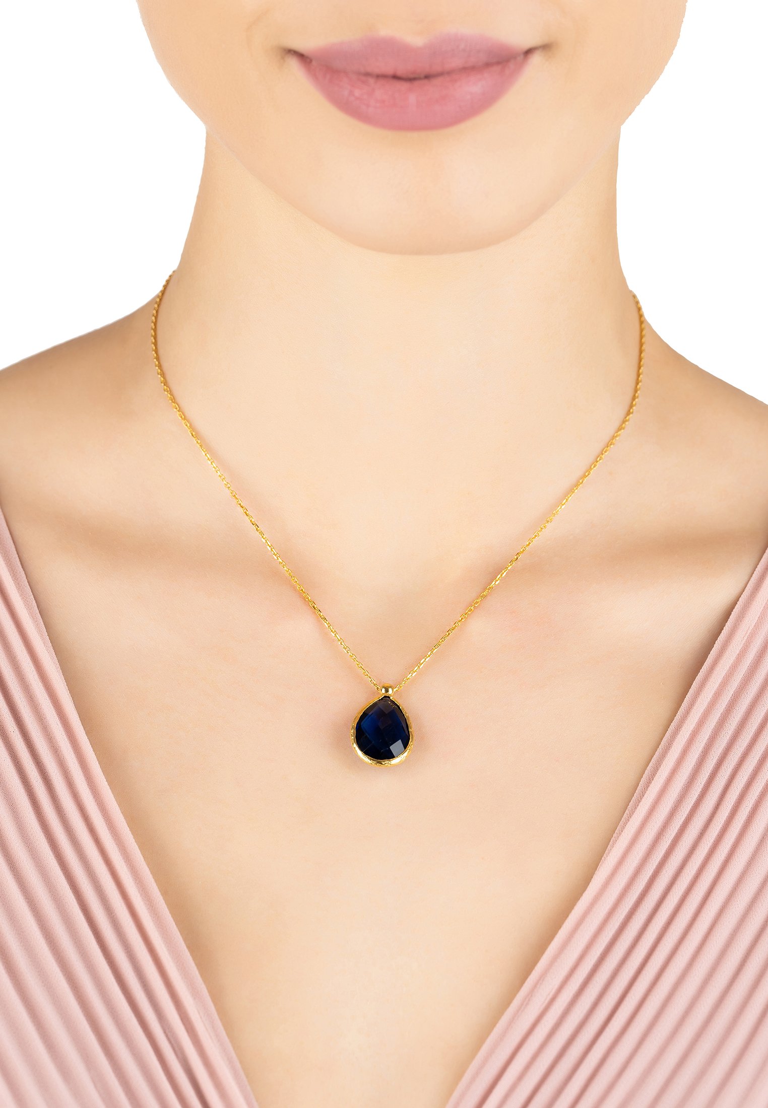 Petite Drop Necklace featuring a gold dipped 925 sterling silver chain with a vibrant sapphire hydro teardrop gemstone.
