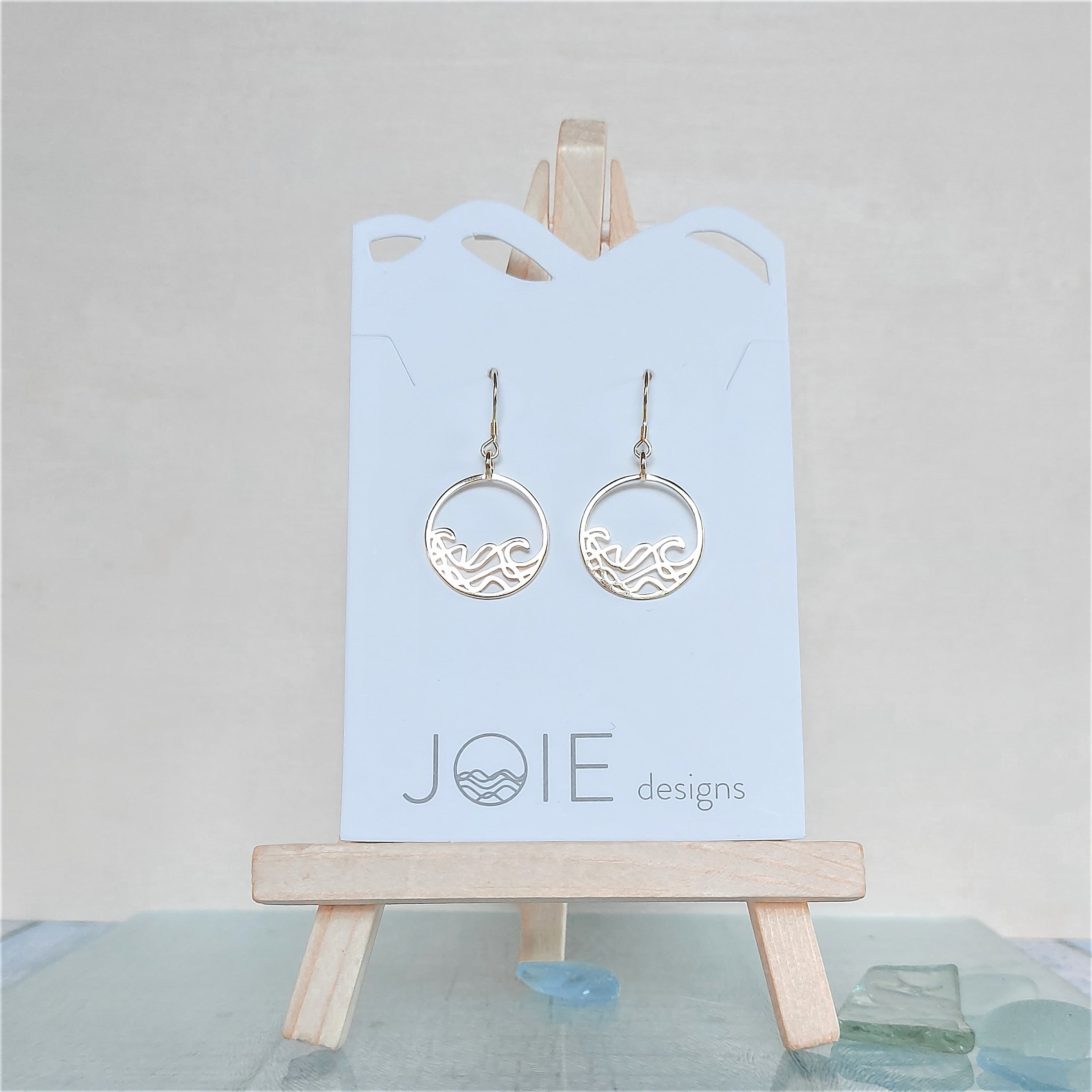 Petite Sombrio Circle Earrings featuring a delicate ocean wave design in 925 Sterling Silver, available in silver, rose gold, and yellow gold.