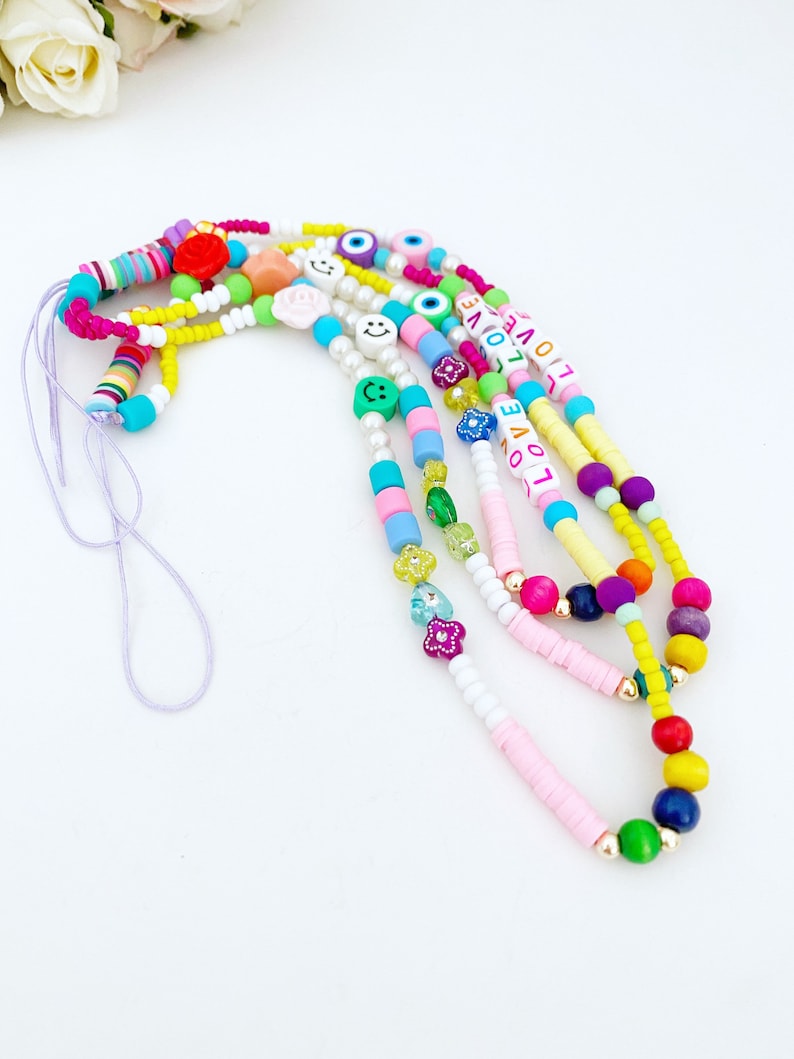 Colorful Rainbow Evil Eye Phone Charm Strap with vibrant beads and protective evil eye design, perfect for stylish phone accessories.