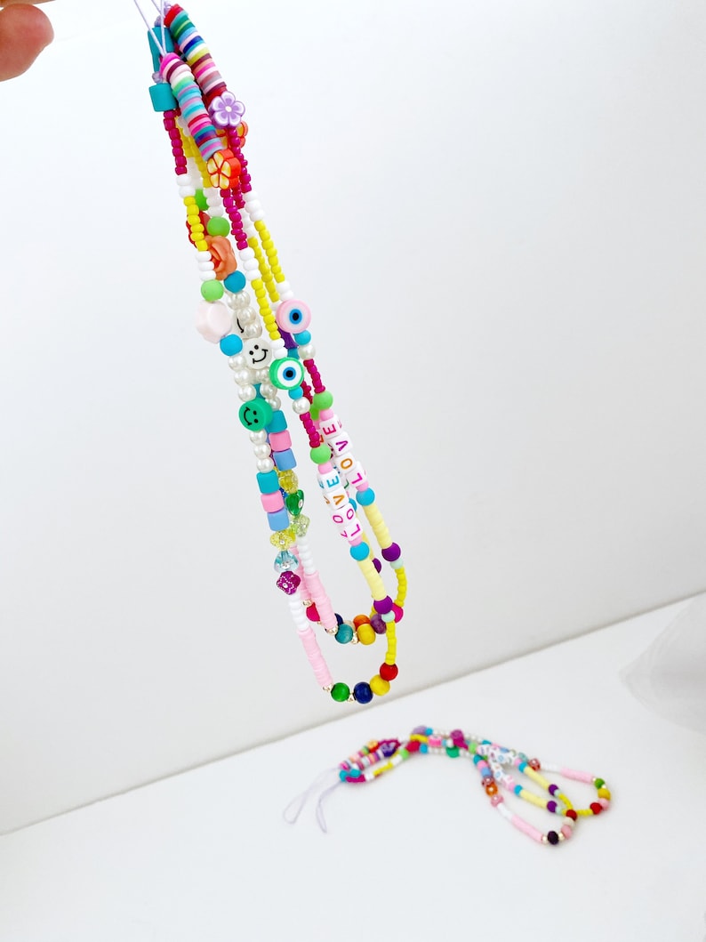 Colorful Rainbow Evil Eye Phone Charm Strap with vibrant beads and protective evil eye design, perfect for stylish phone accessories.
