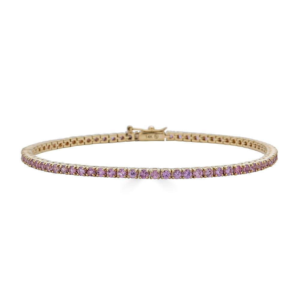 A beautiful Pink Stone Tennis Bracelet featuring natural pink sapphires set in a luxurious 14k solid gold design, perfect for elegant occasions.