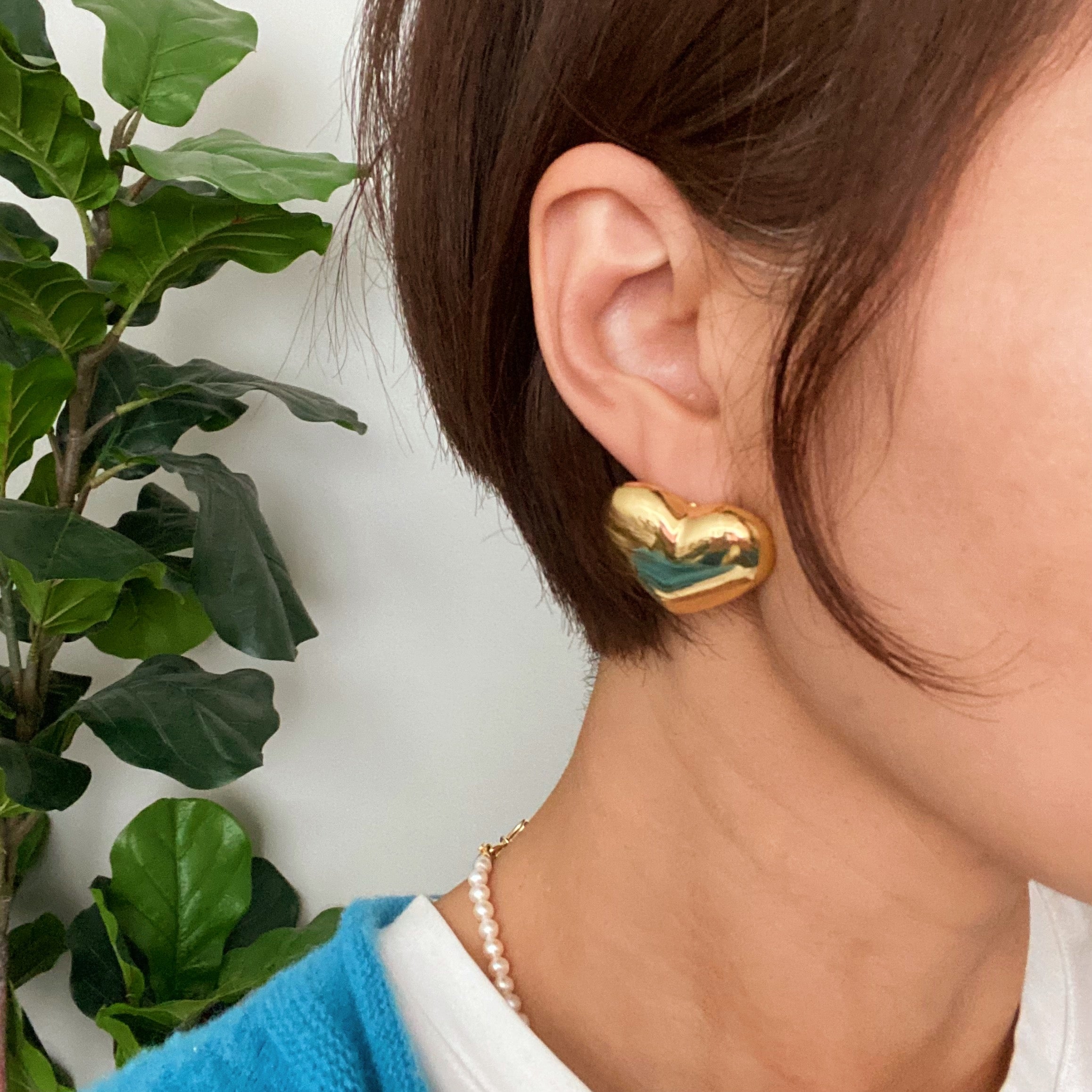 Polish My Heart Stud Earrings featuring a dimensional shape with a polished front and hallowed back, crafted in 18k gold or rhodium plated brass.