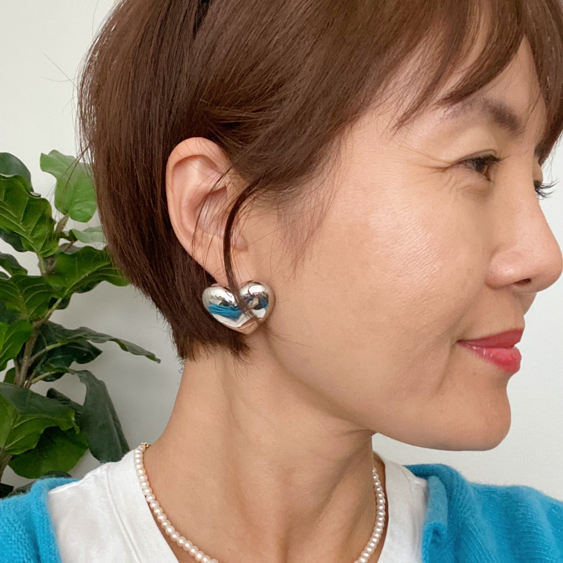 Polish My Heart Stud Earrings featuring a dimensional shape with a polished front and hallowed back, crafted in 18k gold or rhodium plated brass.