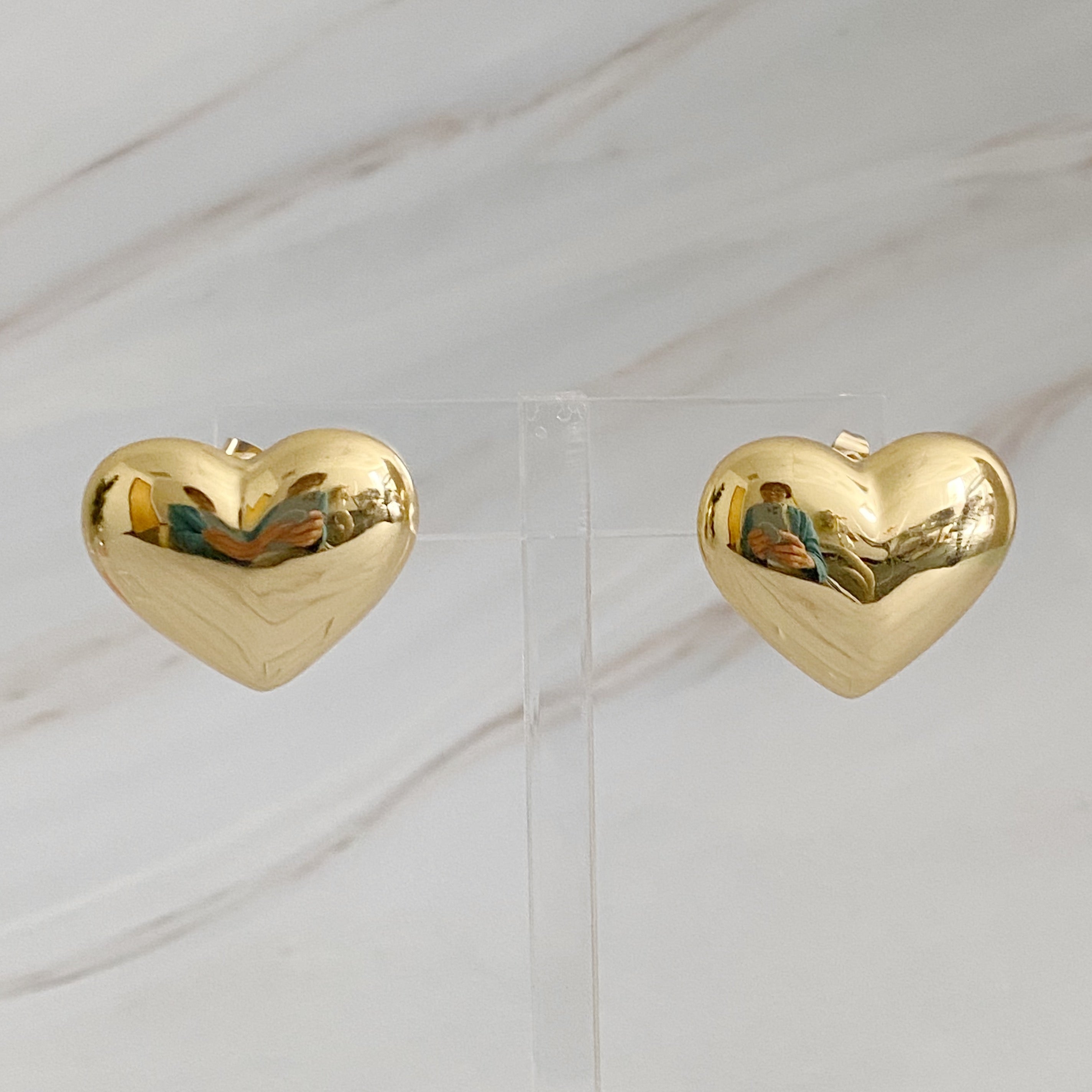 Polish My Heart Stud Earrings featuring a dimensional shape with a polished front and hallowed back, crafted in 18k gold or rhodium plated brass.