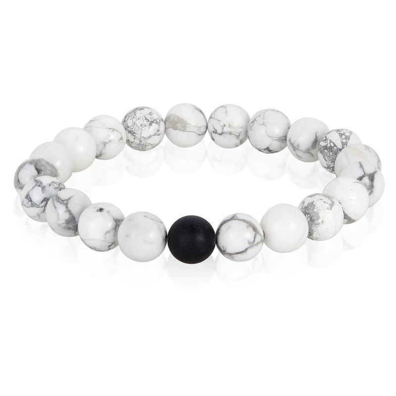 Polished 10mm Howlite bead stretch bracelet featuring 20 natural stone beads and a matte black onyx bead, showcasing a stylish design.