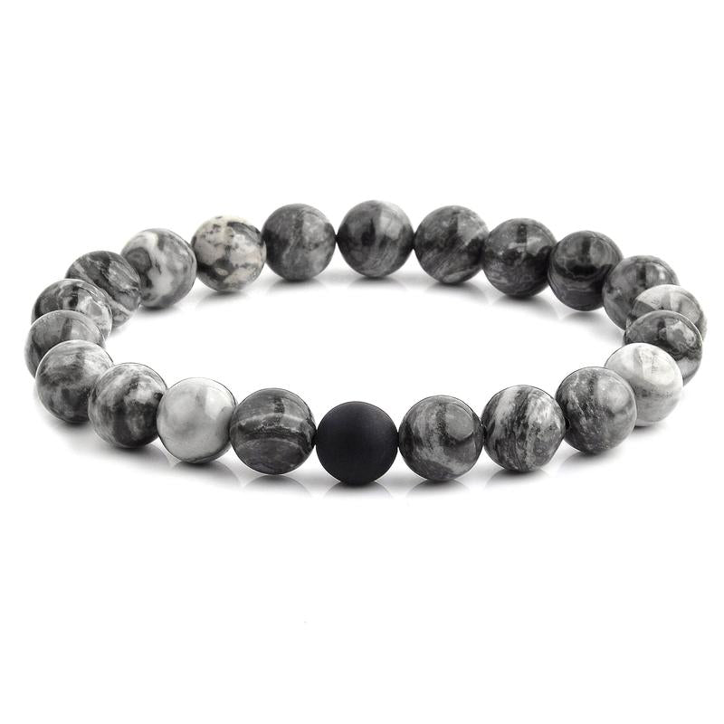 Polished 10mm Natural Stone Bead Stretch Bracelet made of Jasper with a matte black onyx bead, showcasing its elegant design.