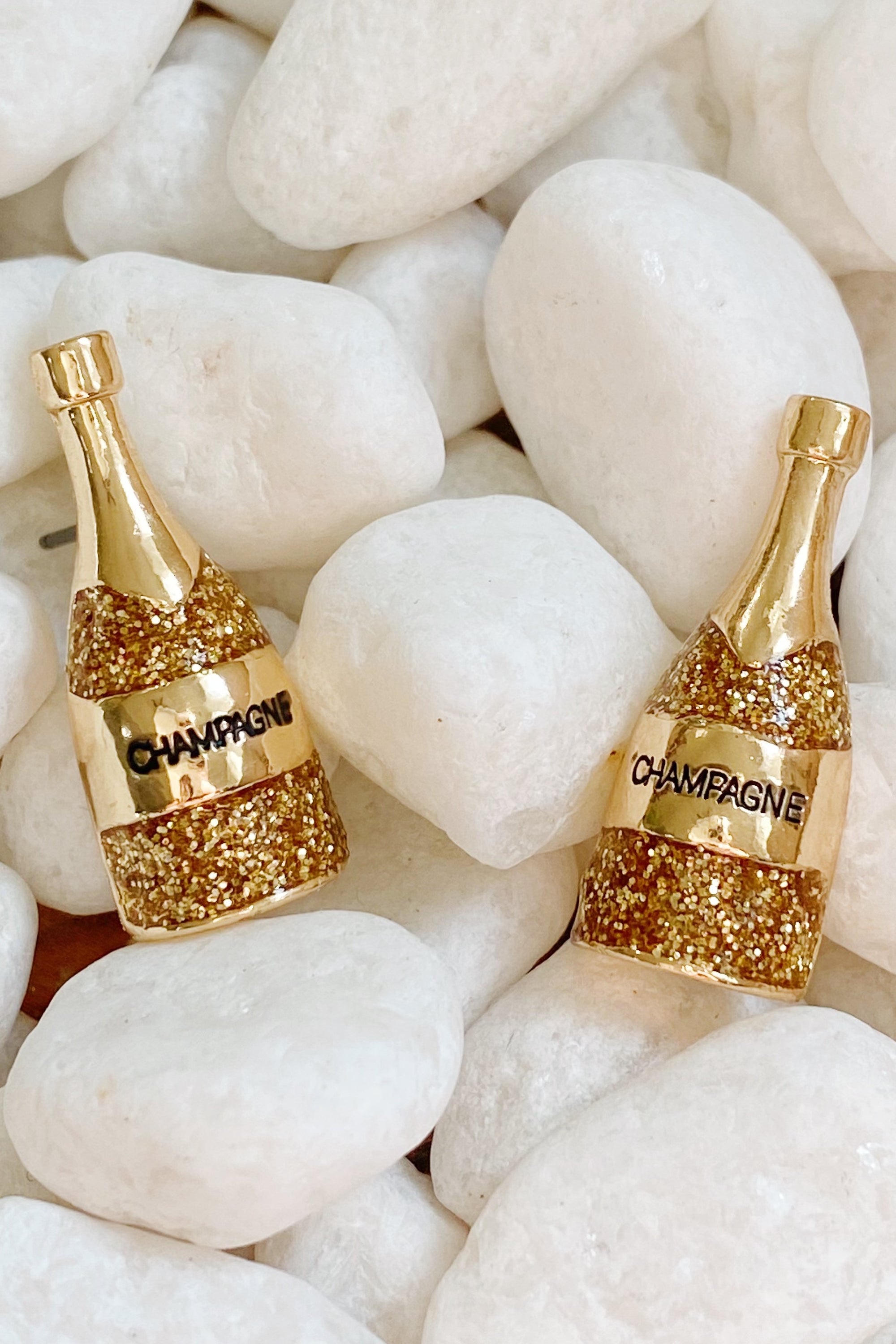 A pair of elegant Pop The Shimmer Stud Earrings with a sparkling finish, perfect for any occasion.