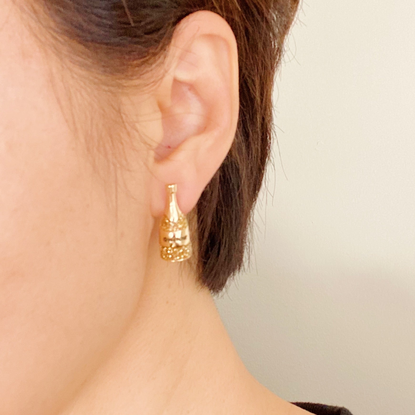 A pair of elegant Pop The Shimmer Stud Earrings with a sparkling finish, perfect for any occasion.