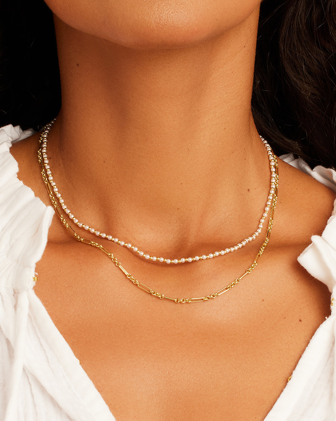Elegant Poppy Pearl Layering Set featuring beautifully layered pearl necklaces, perfect for any occasion.