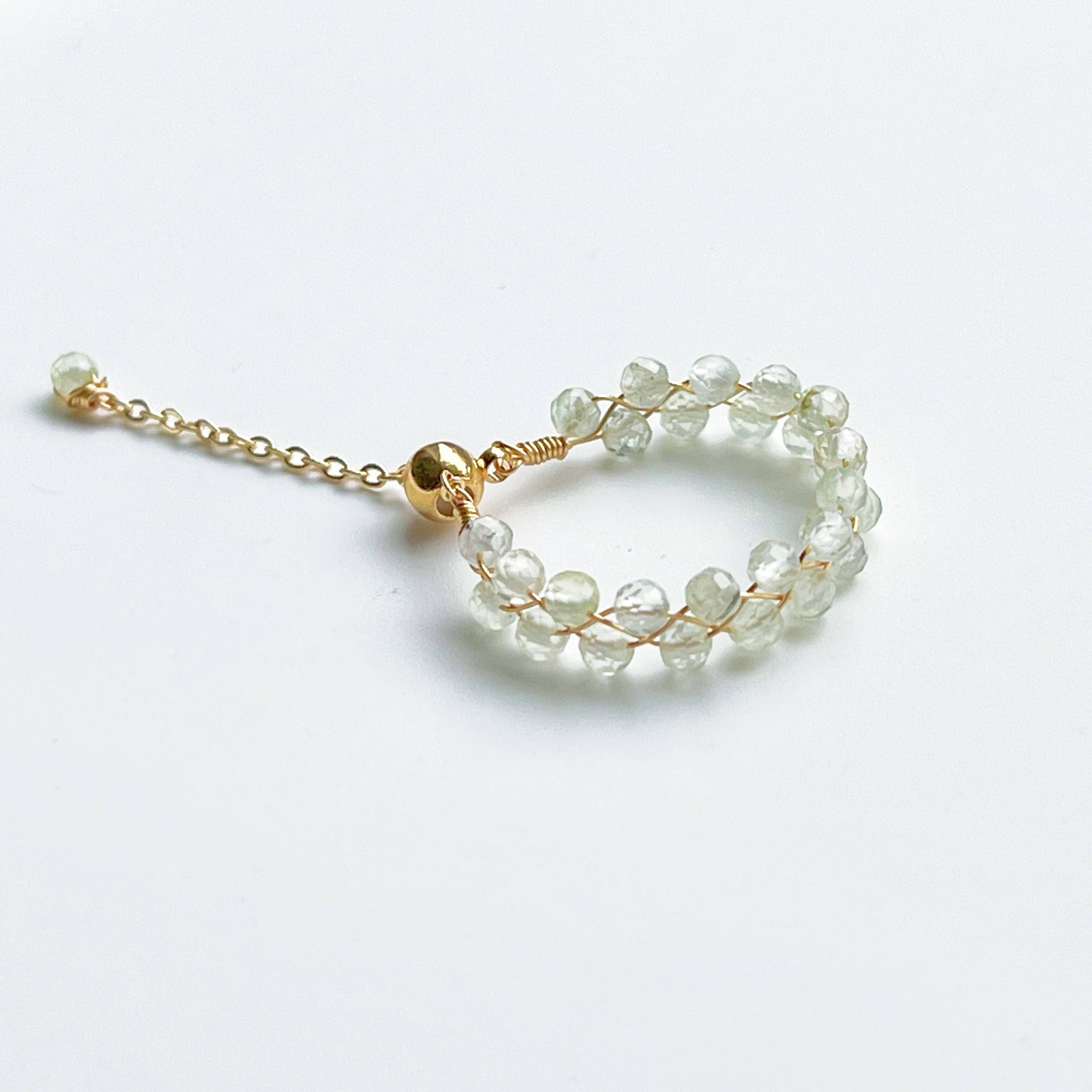 Light green Prehnite beaded adjustable ring with gold plated bronze wire, symbolizing love and healing.