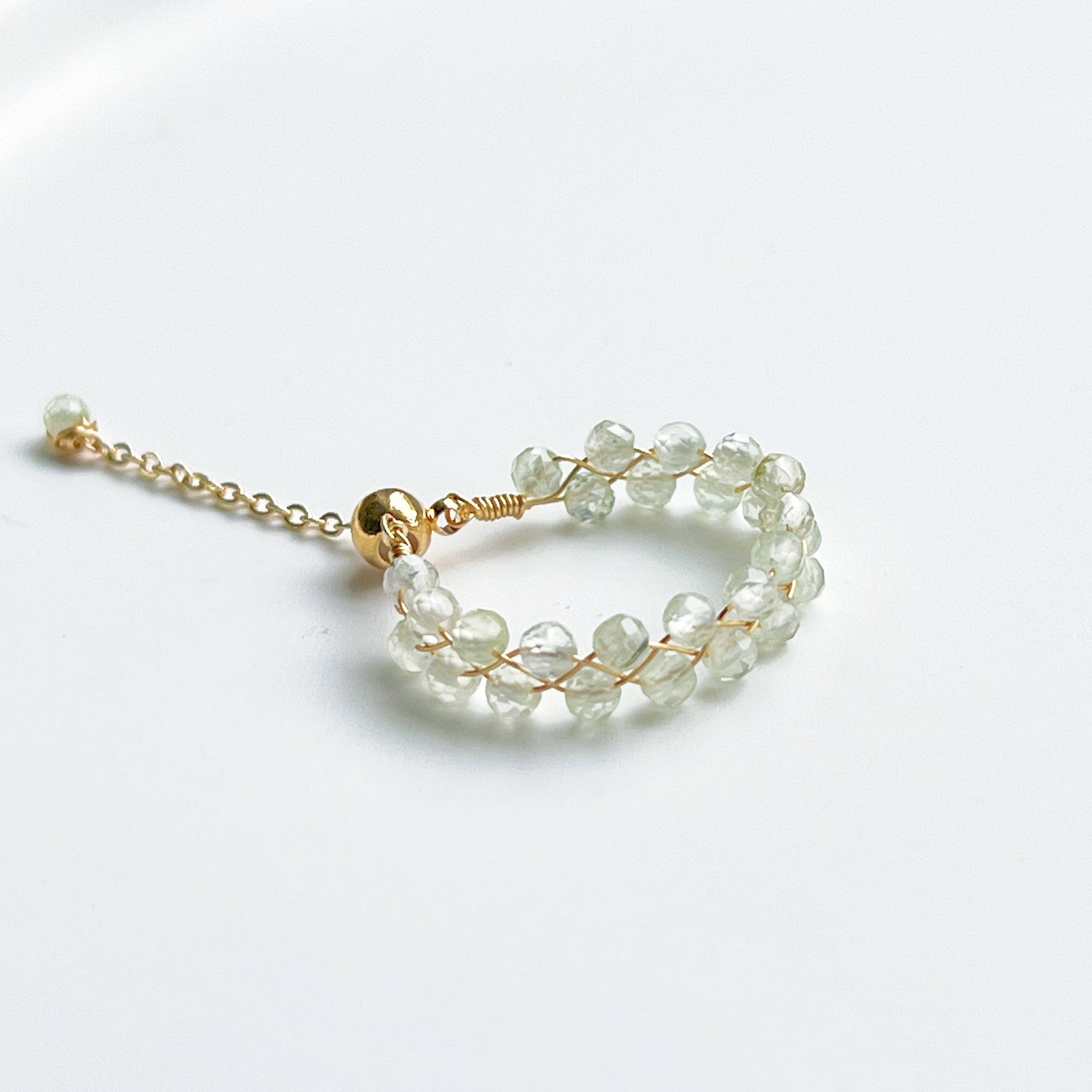 Light green Prehnite beaded adjustable ring with gold plated bronze wire, symbolizing love and healing.