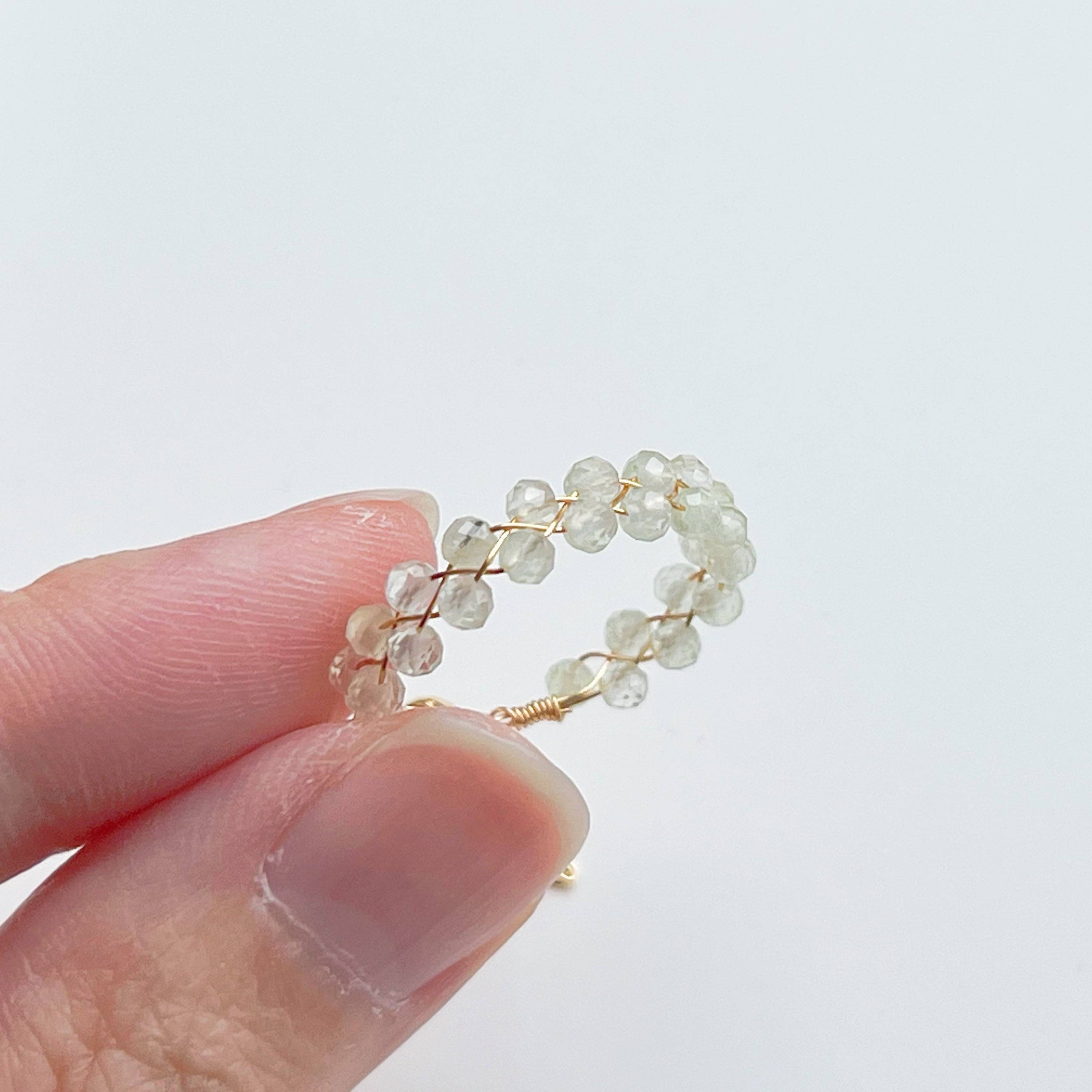 Light green Prehnite beaded adjustable ring with gold plated bronze wire, symbolizing love and healing.