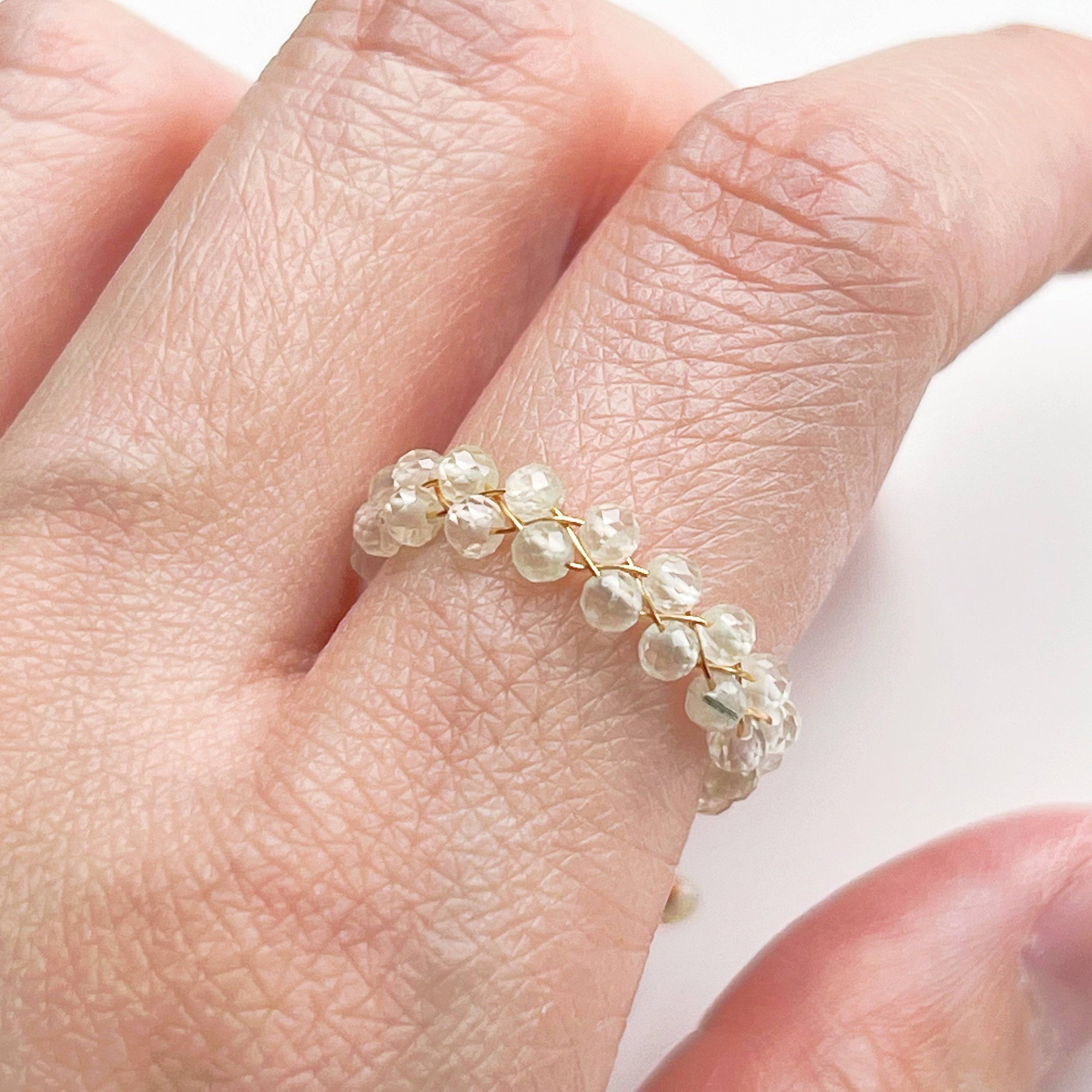 Light green Prehnite beaded adjustable ring with gold plated bronze wire, symbolizing love and healing.