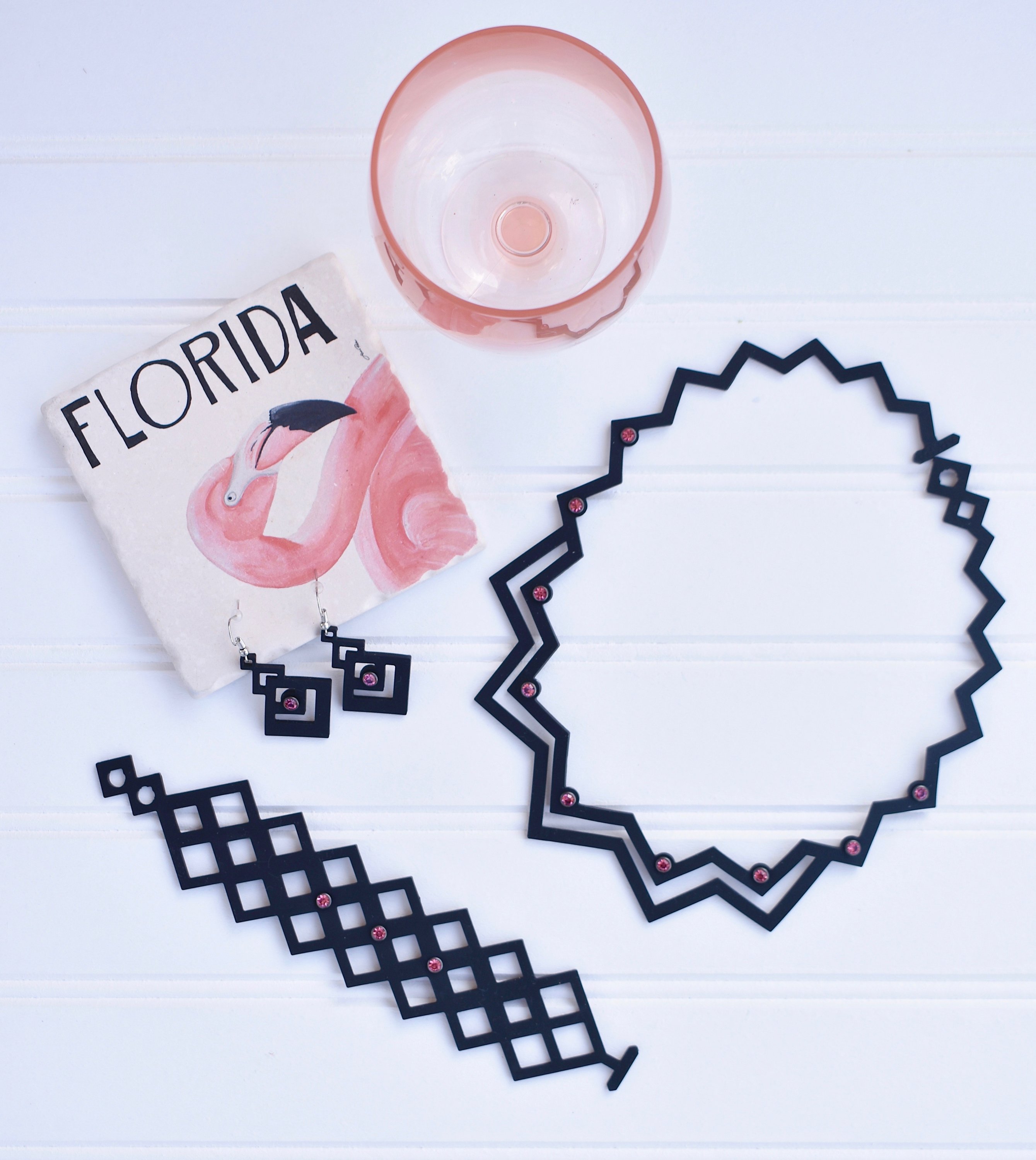 A stylish Pretty Bracelet displayed elegantly in a velvet pouch, showcasing its unique design and vibrant colors.