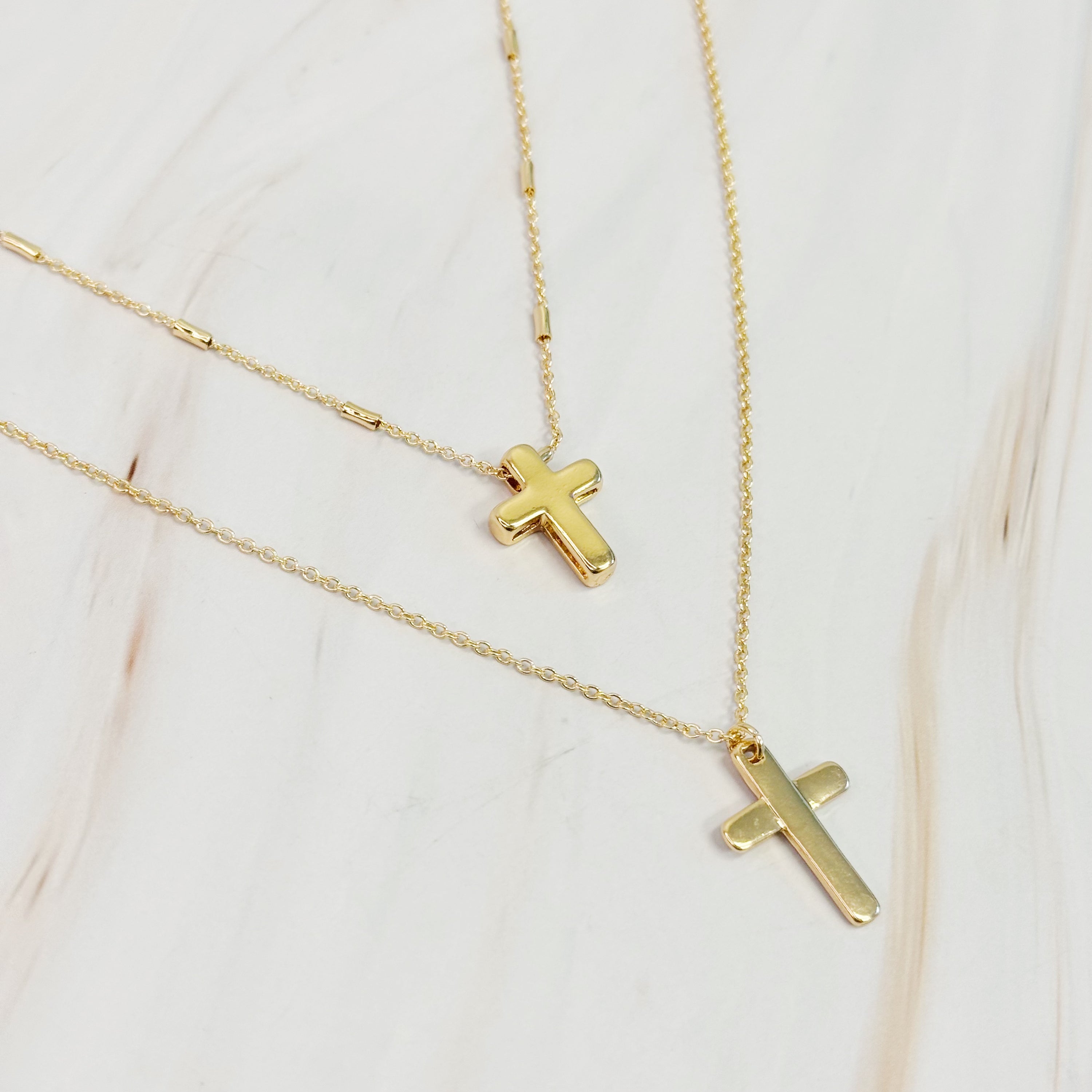 Pretty Chain Cross Necklace Set of 2 featuring modern cross designs on delicate chains, perfect for layering or solo wear.