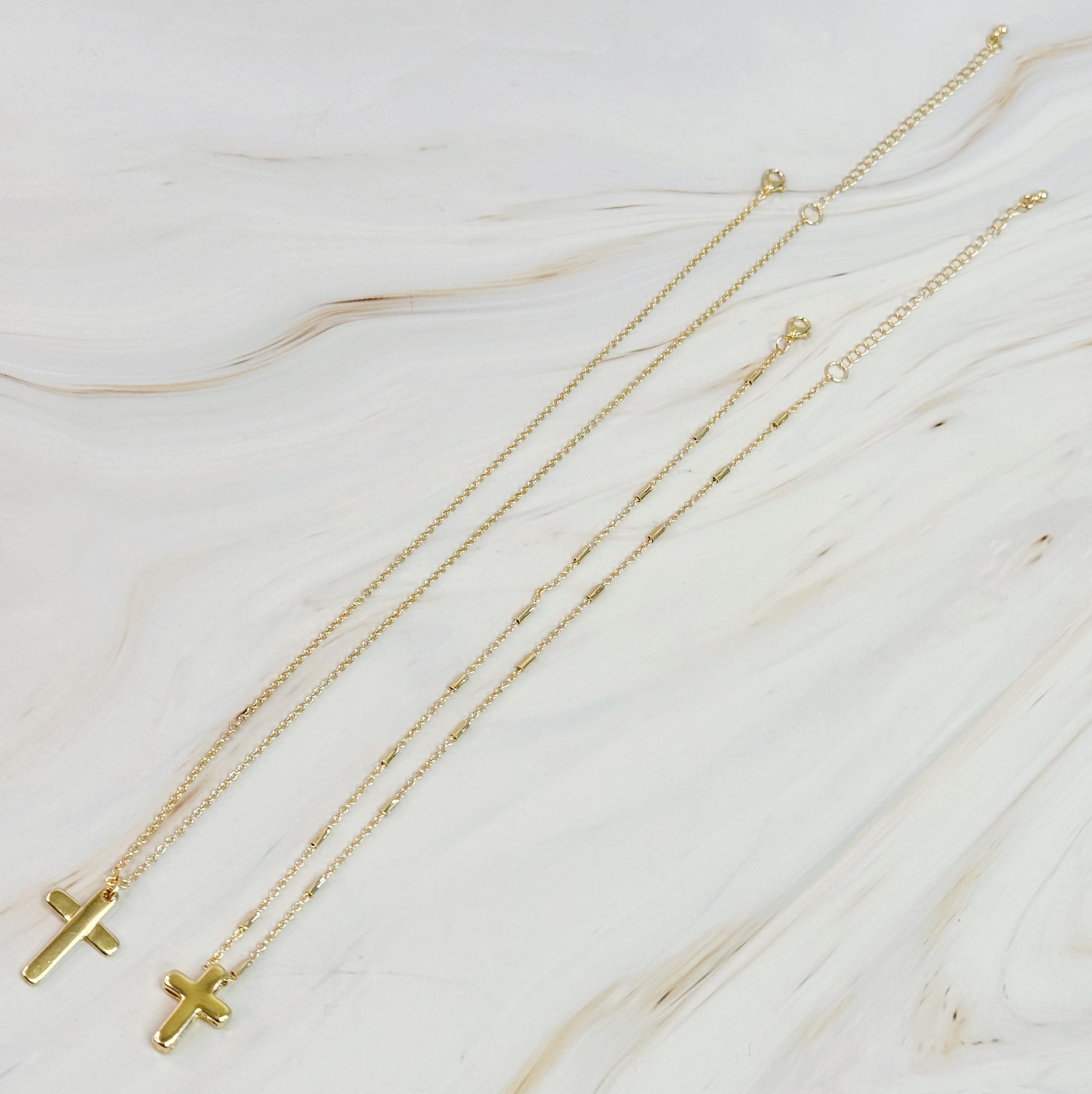 Pretty Chain Cross Necklace Set of 2 featuring modern cross designs on delicate chains, perfect for layering or solo wear.