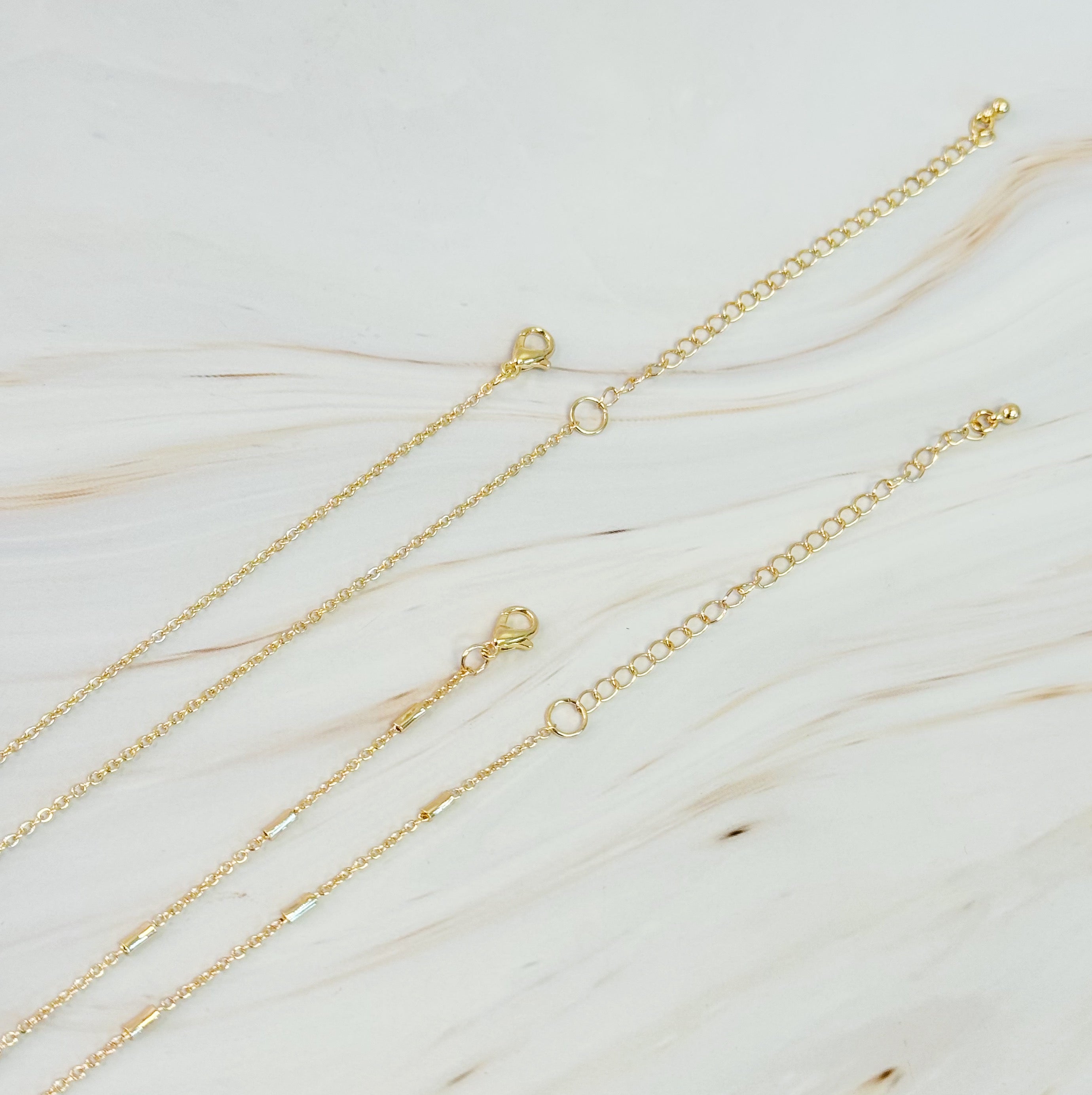 Pretty Chain Cross Necklace Set of 2 featuring modern cross designs on delicate chains, perfect for layering or solo wear.