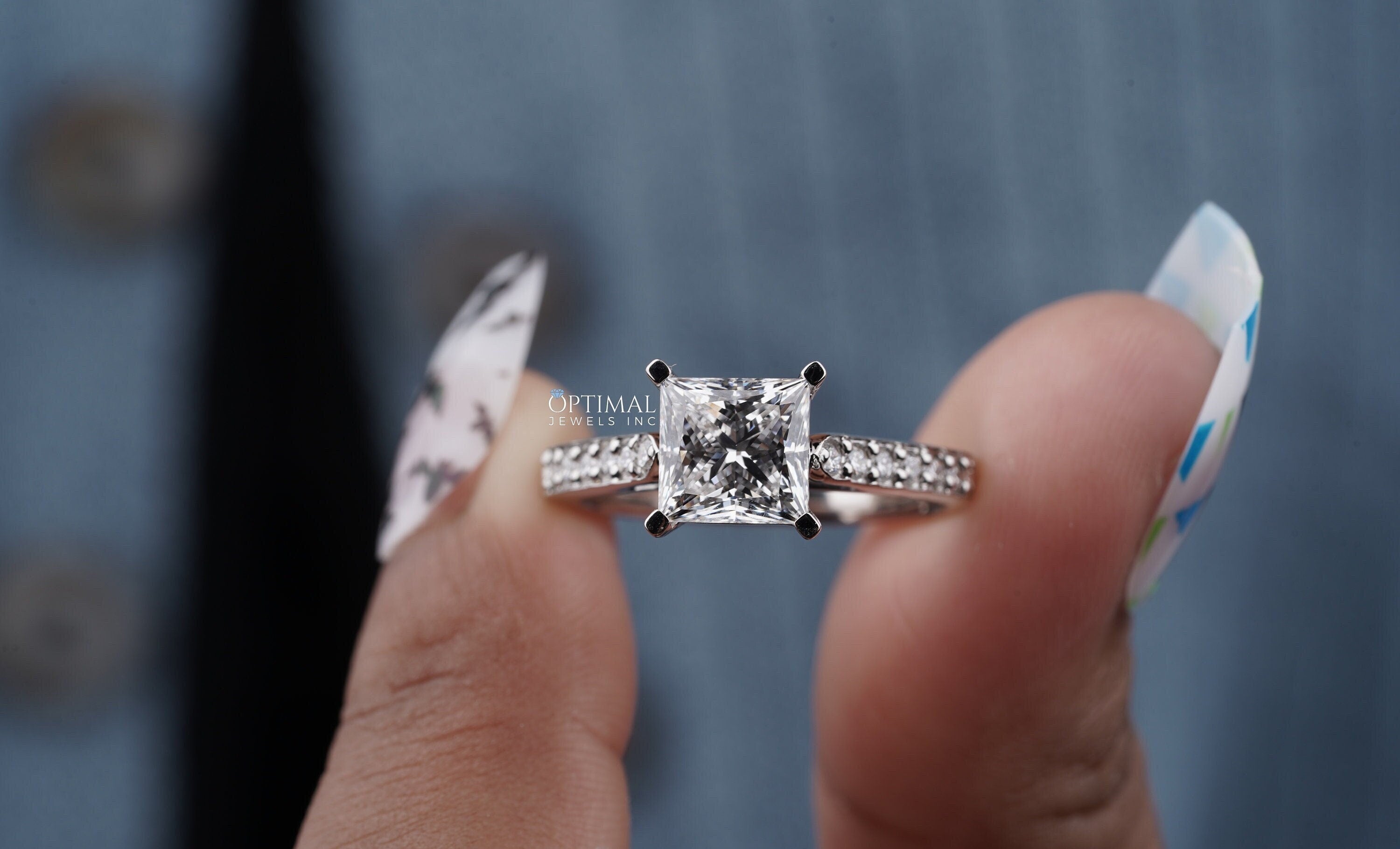 Princess Cut Lab Diamond Ring in white gold, featuring a central 1.80 CT princess cut diamond and round cut side stones, elegantly crafted.