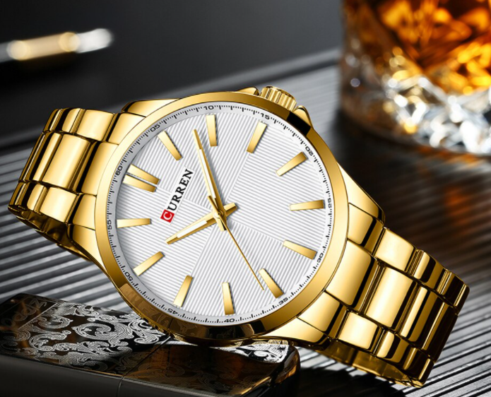 QUAINT Metal Timepiece with round dial and stainless steel strap, showcasing elegance and sophistication.