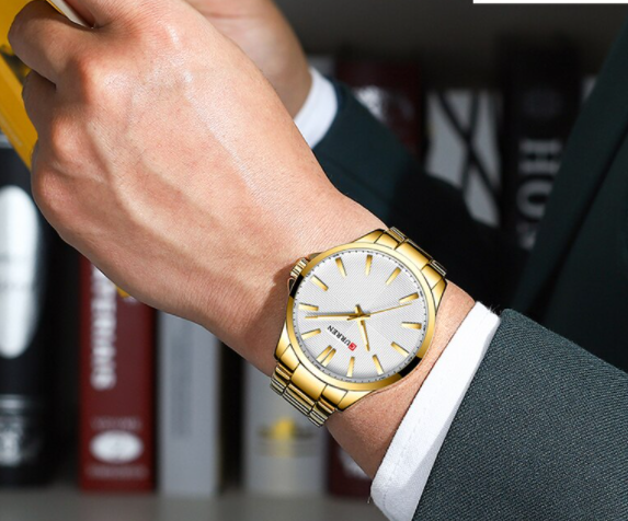 QUAINT Metal Timepiece with round dial and stainless steel strap, showcasing elegance and sophistication.